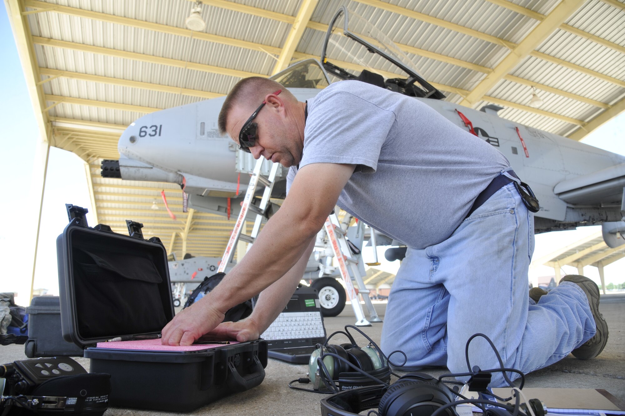 Master Sgt. Robert Boye, 442nd Aircraft Maintenance Squadron crew chief, repacks a wireless system at Whiteman Air Force Base, Mo., June 26, 2013. Eliminating the use of cords reduces tripping hazards and communication failures. (U.S. Air Force photo by Airman 1st Class Keenan Berry/Released) 