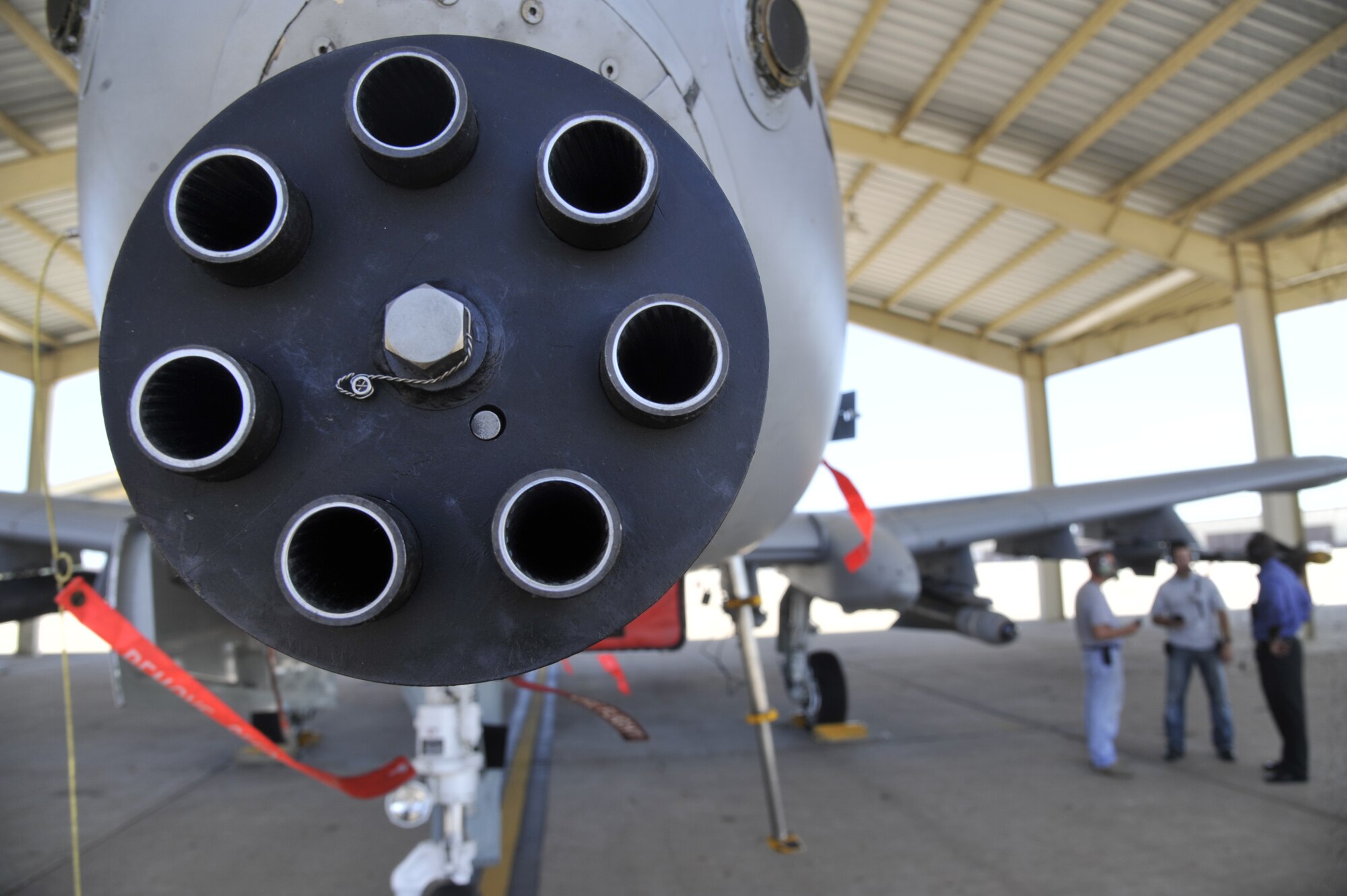 Master Sgt. Robert Boye, left, 442nd Aircraft Maintenance Squadron crew chief, Master Sgt. Justin Johnston, 442nd Fighter Wing ground safety manager, and Garfield Gray, wireless system representative, discuss the specific characteristics of an A-10 Thunderbolt II wireless system at Whiteman Air Force Base, Mo., June 26, 2013. The wireless application allows workers to move unhindered by cumbersome cords in and around the aircraft, while simultaneously preserving clear communication between individuals. (U.S. Air Force photo by Airman 1st Class Keenan Berry/Released)