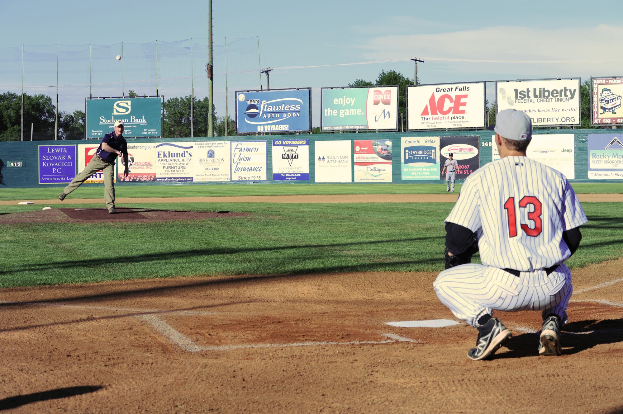 Col. Robert Stanley, 341st Missile Wing commander, throws out the first pitch during Military Appreciation Night at Centene Stadium on June 29 in Great Falls, Mont. Military members were given free tickets to the game, where the Voyagers beat the Billings Mustangs  4-1. (U.S. Air Force photo/Senior Airman Katrina Heikkinen)