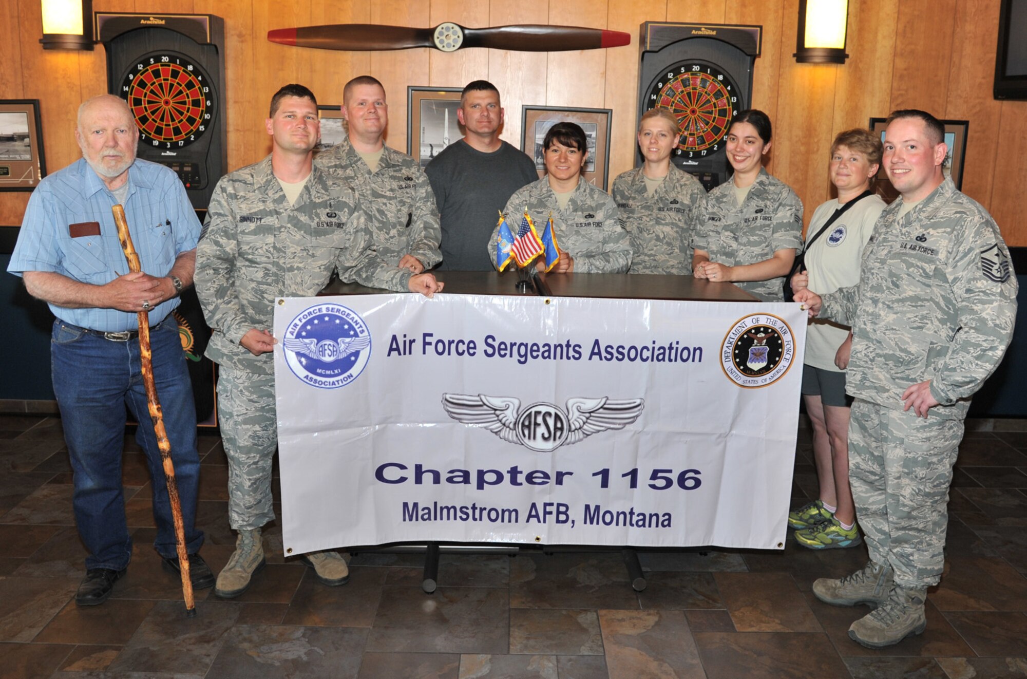 The Malmstrom Air Force Base Air Force Sergeants’ Association Chapter 1156 members pose for a photo at the Grizzly Bend on June 27 after receiving two major awards: 2012 Division 11 Large Chapter of the Year and Division  11 Member of the Year – Master Sgt. Nicholas Sinnott. Pictured from left to right are Jim Simmonds; Sinnott; Tech Sgt. Jonathan Winters; Senior Master Sgt. Samuel Shrewsbury; Staff Sgt. Marveline Engle; Master Sgt. Sherri Crandall; Senior Airman Jennifer Favinger; Tech. Sgt. Kristen Marfa; and Master Sgt. Colin Crandall. (U.S. Air Force photo/John Turner)