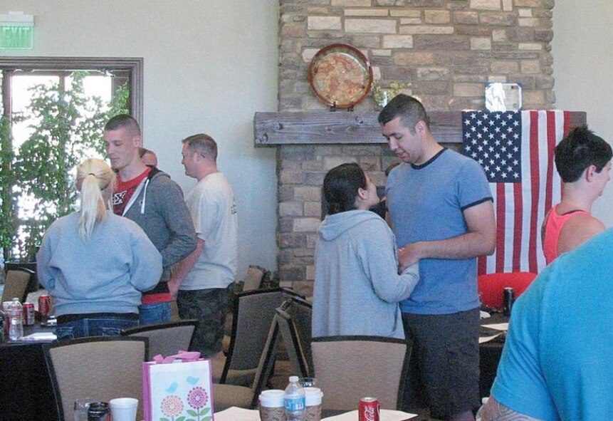 Couples from Hill Air Force Base, Utah, participate in a marital strengthening exercise at the Air Expeditionary Retreat held June 28 at Wolf Creek. The retreats are designed to give military families a chance to strengthen and renew family relationships before or after military deployments. (Courtesy photo by Mary Lou Gorny)