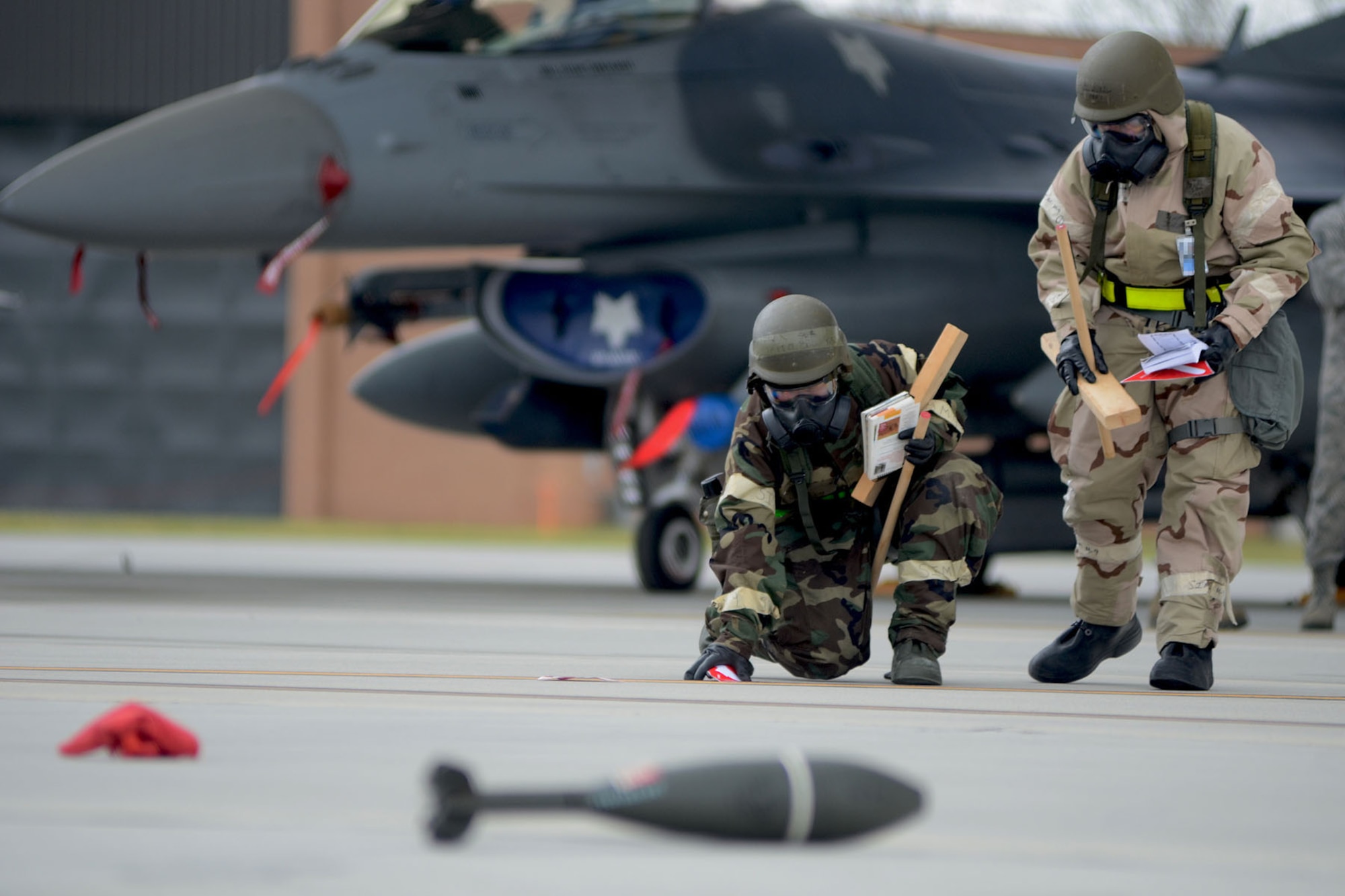 U.S. Air Force Airmen, assigned to a Post Attack Reconnaissance team for the 169th Fighter Wing at McEntire Joint National Guard Base, S.C., conduct PAR checks after a simulated chemical attack on the flight line during a Phase II Readiness Exercise, April 12, 2013. Members of the 169th Fighter Wing are preparing for a Phase I and II Readiness Inspection, which evaluates a unit's ability to deploy, then operate and launch missions in a chemical combat environment.  
(U.S. Air National Guard photo by Tech. Sgt. Caycee Watson/Released)
