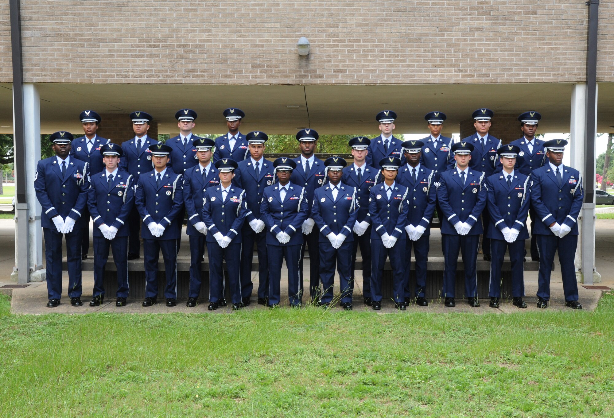 Keesler Honor Guard members from Class 2013C take a group photo June 26, 2013, at the Locker House, Keesler Air Force Base, Miss.   The Keesler Honor Guard’s primary mission is to render military honors for our nation’s fallen service members.  They also support other ceremonial functions such as saber/sword cordons, parades, posting of the colors at retirements, change of commands, prisoner of war/missing in action honors, weddings, sporting events and venues within the local community.  (U.S. Air Force photo by Kemberly Groue)