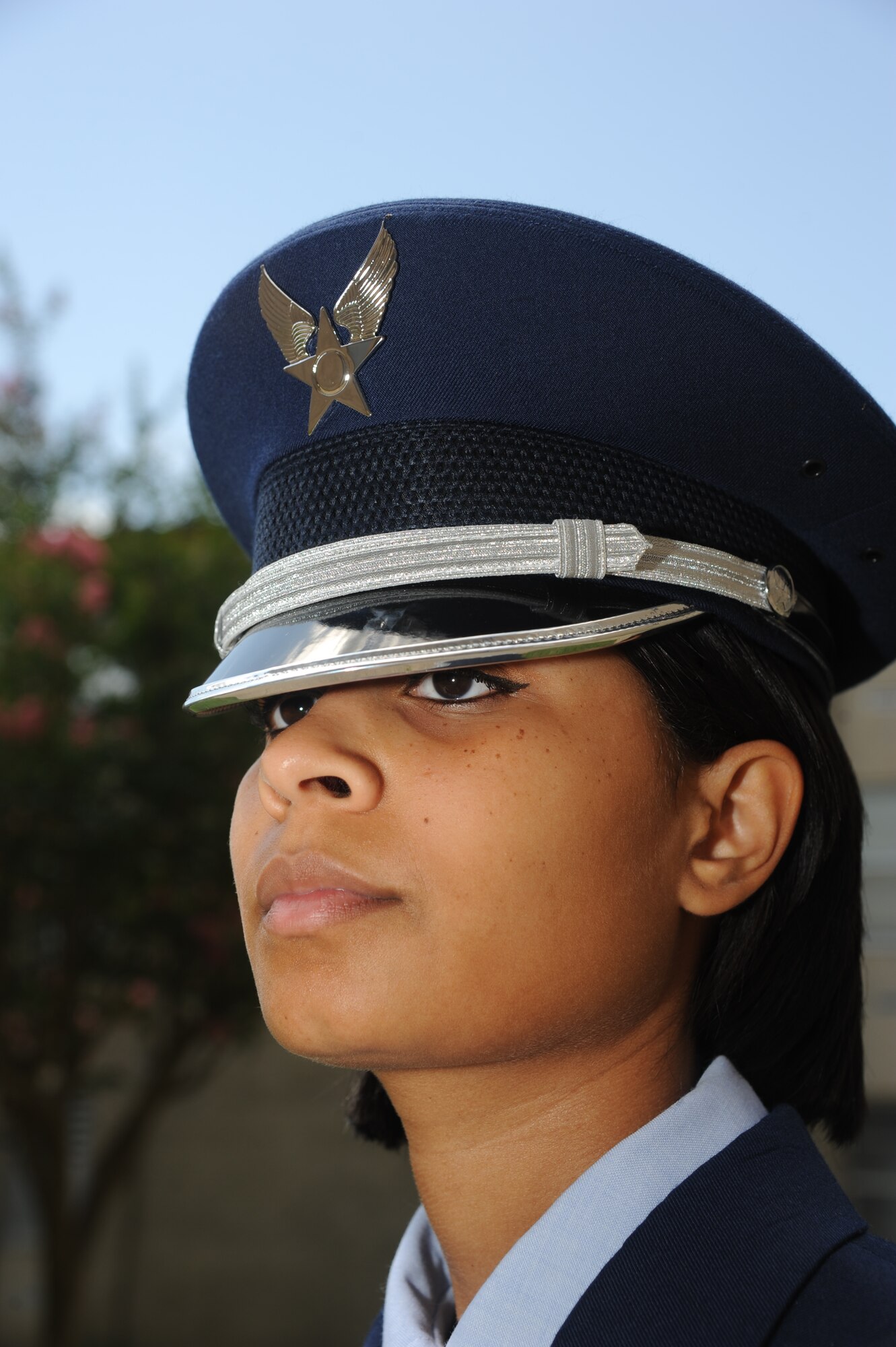 Senior Airman Valarie Chalys, Keesler Honor Guard, stands at attention while wearing the Honor Guard uniform during a training session June 26, 2013, at the Locker House, Keesler Air Force Base, Miss. The Keesler Honor Guard’s primary mission is to render military honors for our nation’s fallen service members.  They also support other ceremonial functions such as saber/sword cordons, parades, posting of the colors at retirements, change of commands, prisoner of war/missing in action honors, weddings, sporting events and venues within the local community.  (U.S. Air Force photo by Kemberly Groue)