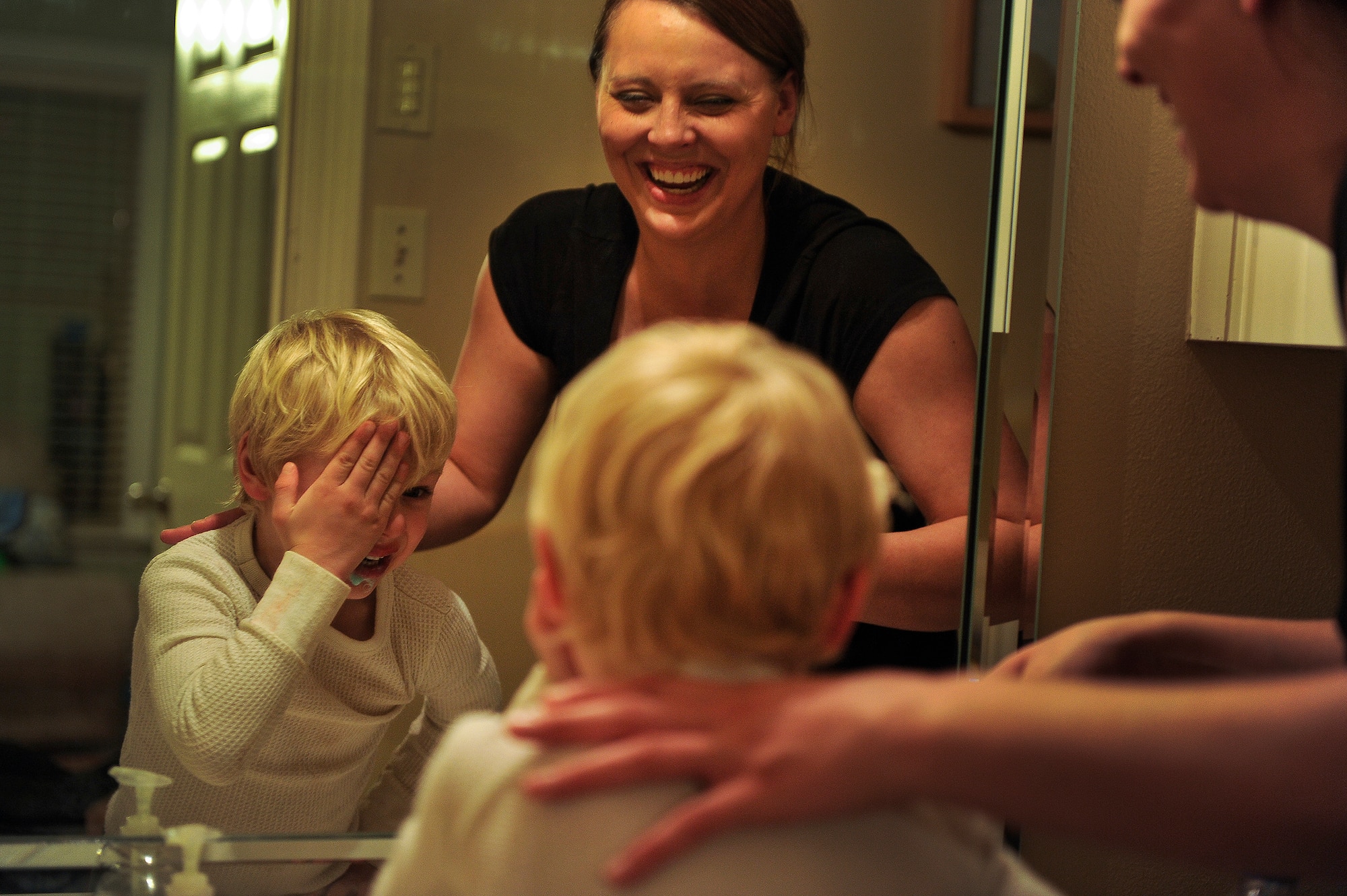 Heather Drain laughs with her son, Ayden, while brushing his teeth before bed Jan. 17, 2013, in Cabot, Ark. Drain said that not having her husband home for moments like this was one of the hardest parts of the deployment.  (U.S. Air Force photo by Staff Sgt. Russ Scalf)
