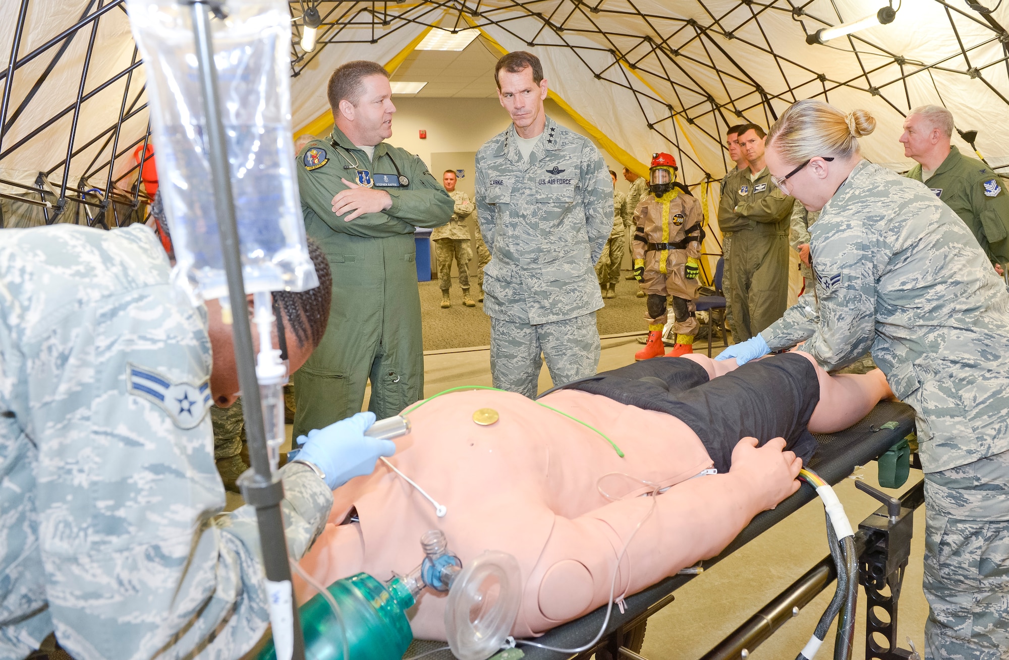 Maj. Stephen Baffic, Homeland Response Force surgeon with the 116th Air Control Wing, briefs Lt. Gen. Stanley E. Clarke III, director of the Air National Guard, during a hands-on demonstration by the 116th Medical Group's Chemical, Biological, Radiological, Nuclear and Explosives Enhanced Response Force unit during Clarkes orientation visit to the JSTARS unit at Robins Air Force Base, Ga., July 3, 2013.  The visit is Clarke's first to Team JSTARS since becoming director of the Air National Guard.  During the visit Clarke received a mission orientation, toured the E-8C and visited Airmen and Soldiers throughout the unit. (U.S. Air National Guard photo by Master Sgt. Roger Parsons/Released)