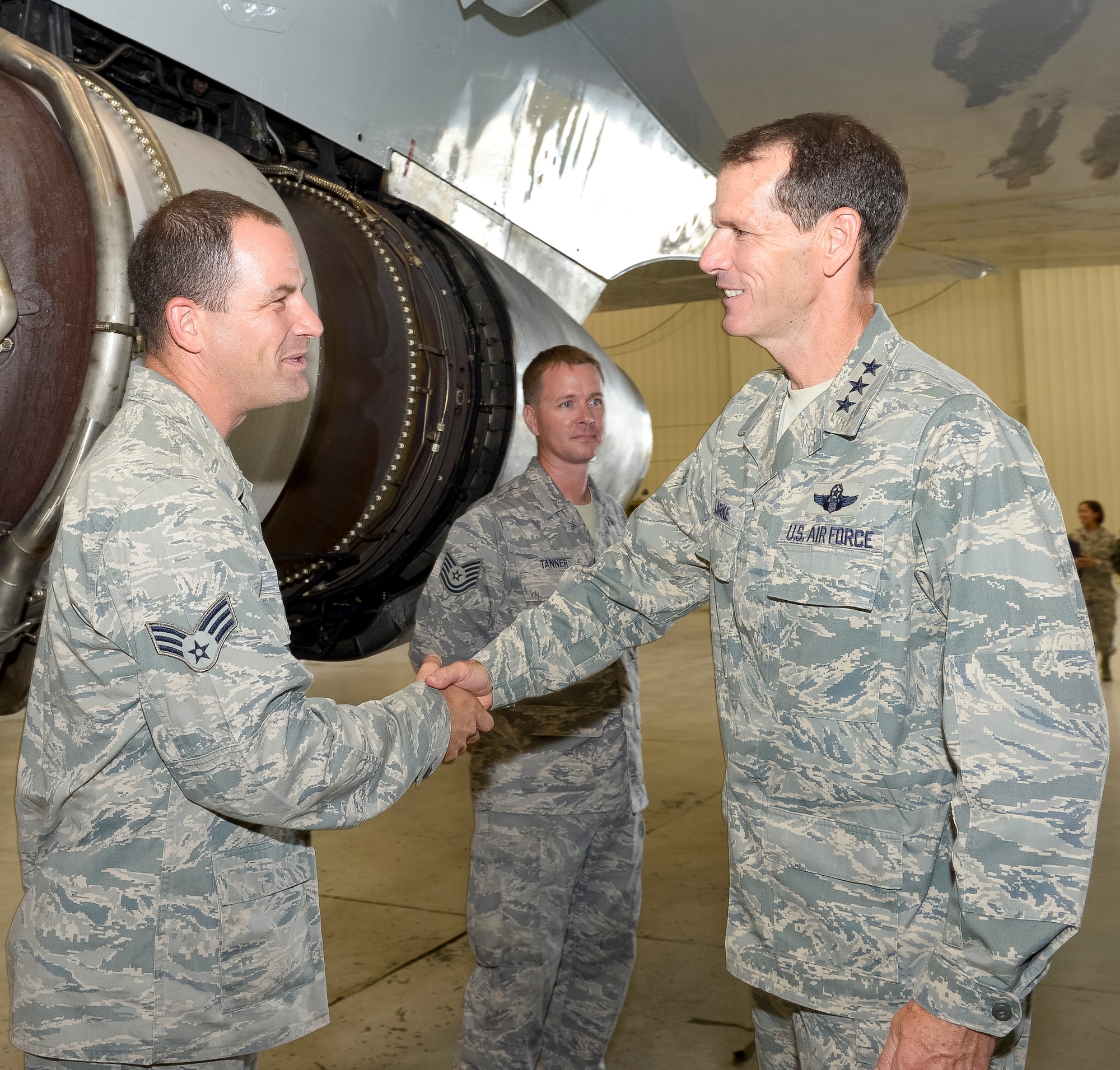 Lt. Gen. Stanley E. Clarke III, director of the Air National Guard, greets Senior Airman Jason Sabaka, 116th Maintenance Squadron, during an orientation visit to the 116th and 461st Air Control Wings at Robins Air Force Base, Ga., July 3, 2013.  The visit is Clarke's first to Team JSTARS since becoming director of the Air National Guard.  During the visit Clarke received a mission orientation, toured the E-8C and visited Airmen and Soldiers throughout the unit. (U.S. Air National Guard photo by Master Sgt. Roger Parsons/Released)
