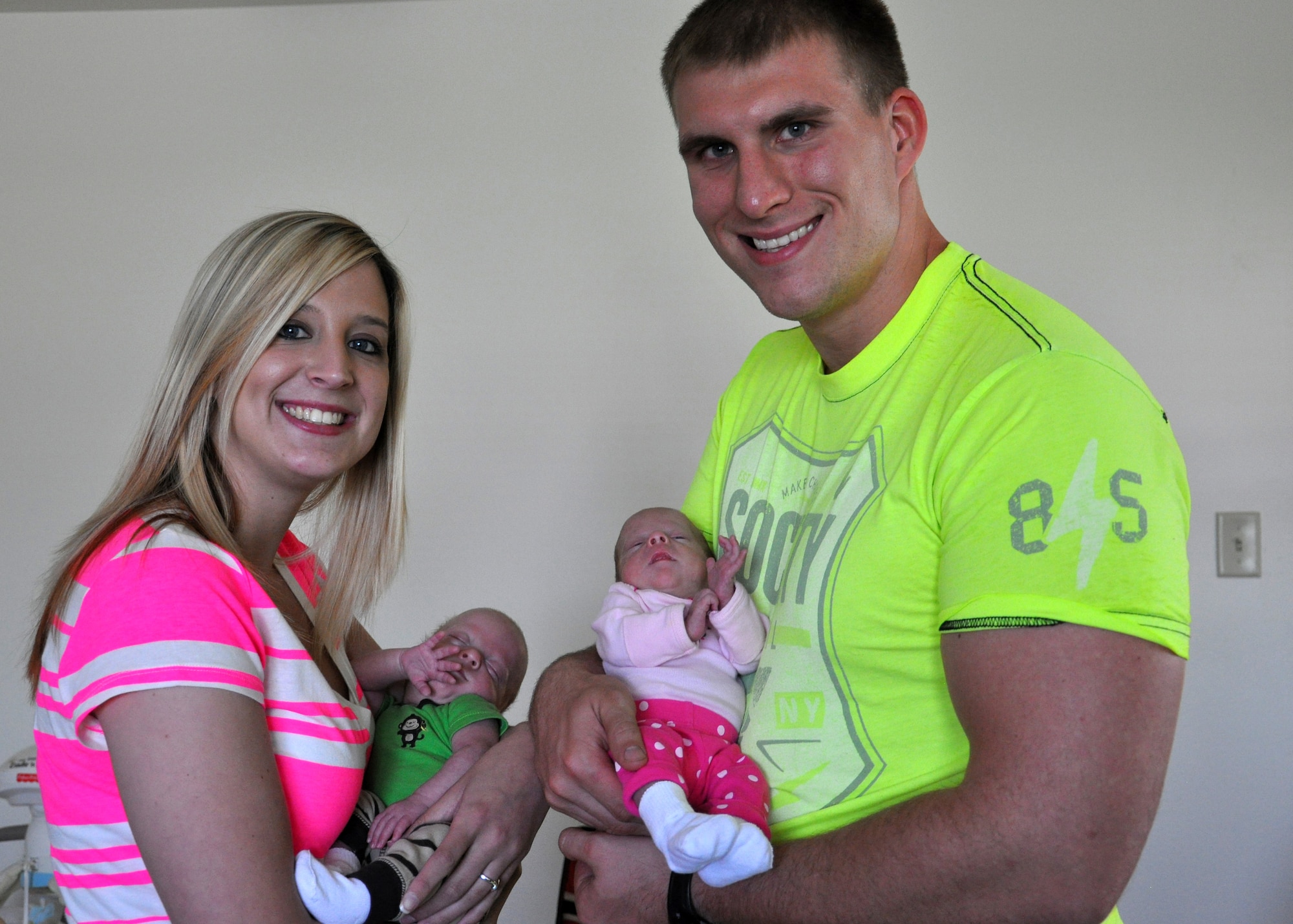 Katie and Travis Alton hold their twins, Jenson and Ally, June 25, 2013. at Little Rock Air Force Base, Ark. The family travelled from Yokota Air Base, Japan, to Okinawa, Japan, to Hickam Air Force Base, Hawaii to Little Rock Air Force Base, Ark., to receive better treatment for their premature babies. (U.S. Air Force photo by Senior Airman Regina Agoha)