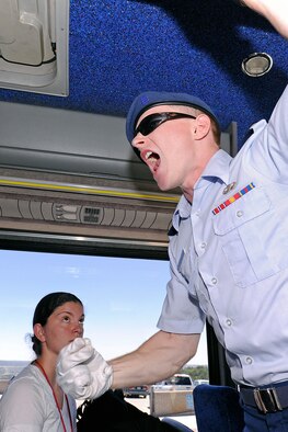 U.S. Air Force Academy Cadet James Lockman, a junior, gives an order for the basics to exit the bus during the Class of 2017 Inprocessing Day June 27, 2013, at the U.S. Air Force Academy in Colorado Springs, Colo. Each cadet graduates with a Bachelor of Science degree and a commission as a second lieutenant in the Air Force. (U.S. Air Force photo/Sarah Chambers)