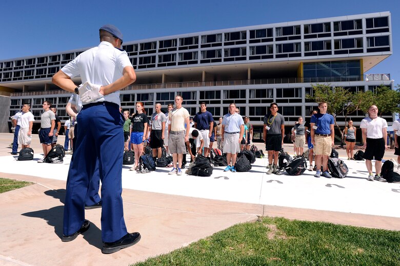 U.S. Air Force Academy cadet cadre members survey a group of basic cadets on the footprints during the Class of 2017 Inprocessing Day June 27, 2013, at the U.S. Air Force Academy in Colorado Springs, Col. Cadets are exposed to a balanced curriculum that provides a general and professional foundation essential to a career Air Force officer.  (U.S. Air Force photo/Sarah Chambers)