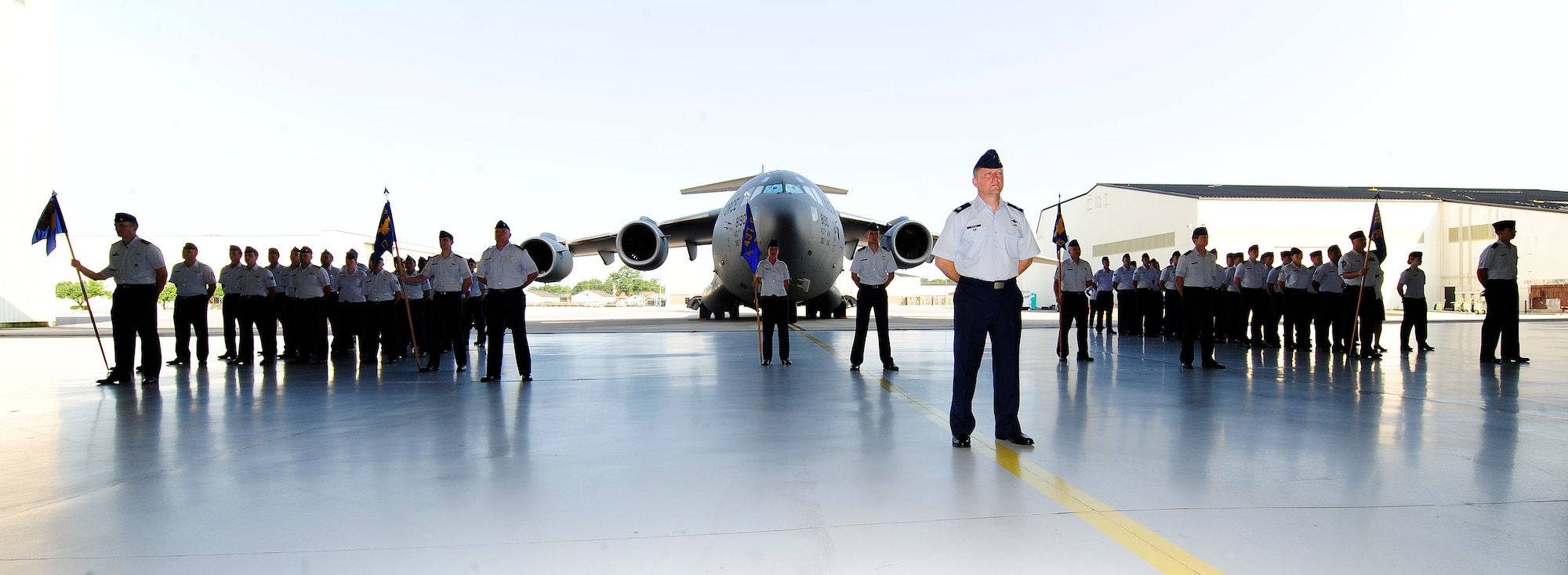 Members of the 437th Operations Group stand in formation during the 437th OG change of command June 27, 2013, in Nose Dock 2 at Joint Base Charleston – Air Base, S.C. Col. Fred Boehm took command of the 437th OG from Col. Trevor Nitz. (U.S. Air Force photo/Staff Sgt. Rasheen Douglas)