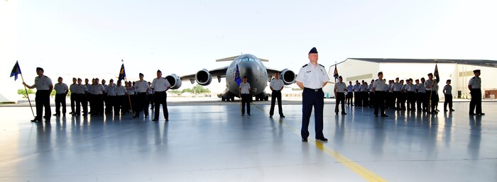 Members of the 437th Operations Group stand in formation during the 437th OG change of command June 27, 2013, in Nose Dock 2 at Joint Base Charleston – Air Base, S.C. Col. Fred Boehm took command of the 437th OG from Col. Trevor Nitz. (U.S. Air Force photo/Staff Sgt. Rasheen Douglas)