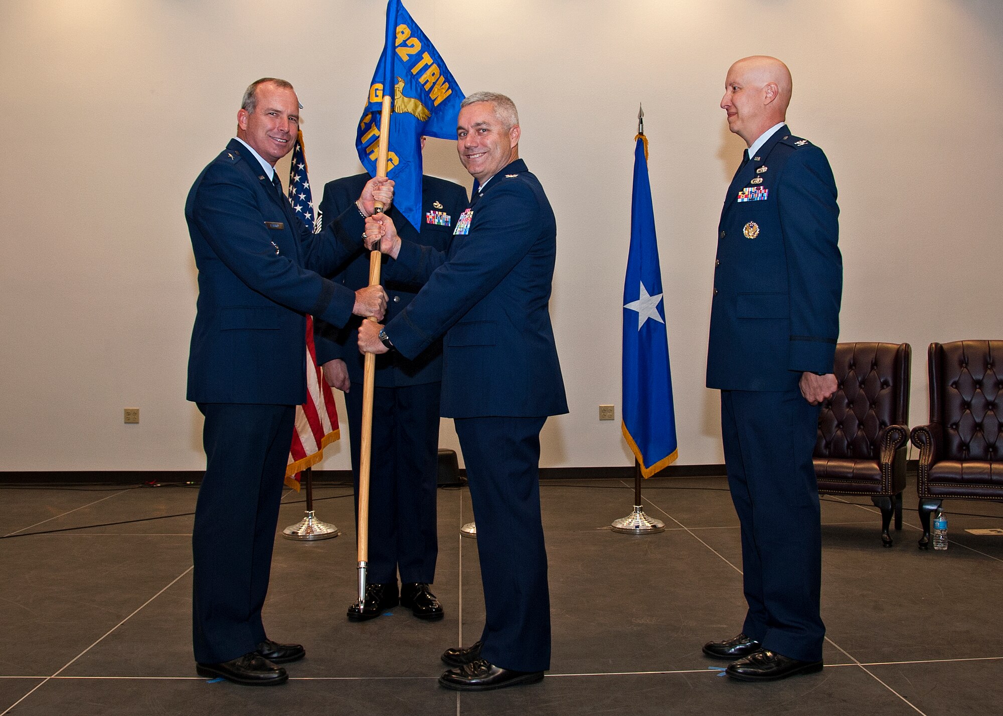 U.S. Air Force Brig. Gen. Michael Fantini, 82nd Training Wing Commander hands over command of the 982nd Training Group to Col. Bernard Hatch. Col. Peter Markle stands by after being relieved of command from the 982nd TRG on July 03, 2013 at Sheppard Air Force Base, Texas. (U.S. Air Force photo by Frank Carter)