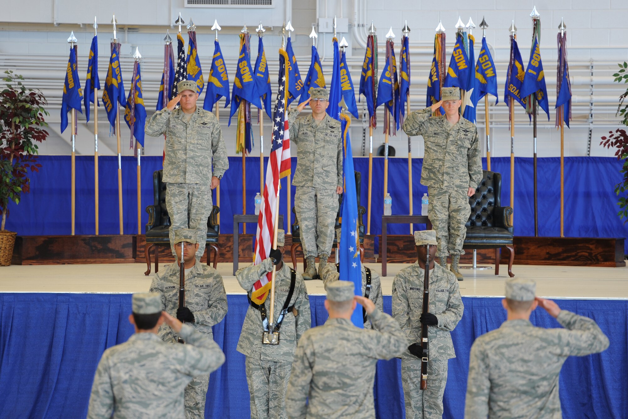 Hurlburt Field Honor Guard posts the colors for the national anthem during the 1st Special Operations Wing change of command ceremony at the Freedom Hangar on Hurlburt Field, Fla., July 3, 2013. More than 500 Air Commandos attended the ceremony where Col. Jim Slife relinquished command to Col. William West. (U.S. Air Force photo/Senior Airman Kentavist Brackin) 