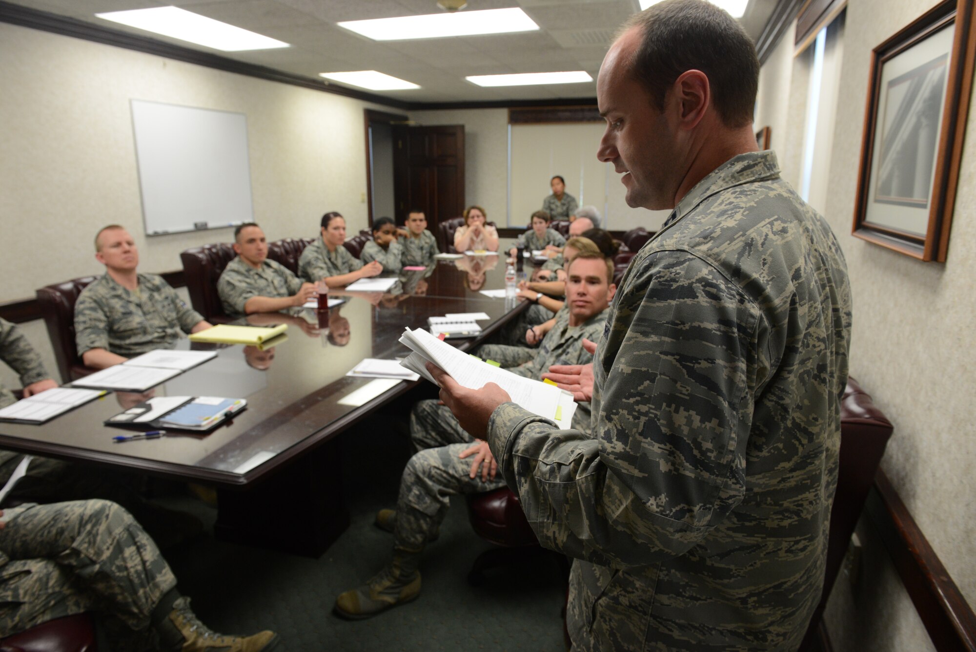 Capt. Theran Fries, 375th Air Mobility Wing Judge Advocate, reviews AFIs and policies with the office June 26. The 375th Air Mobility Wing Judge Advocate office completed part one of a two-part Article Six inspection through a similar process June 3-7. (U.S. Air Force photo/Senior Airman Jake Eckhardt)