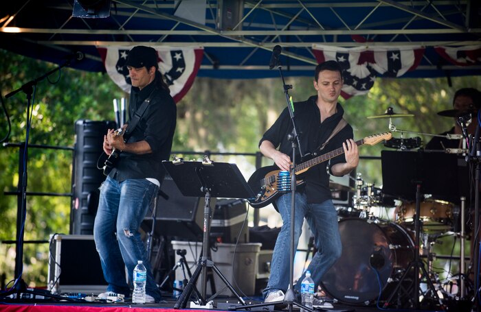Members of the band Zero to Never perform June 28, during the 2013 Freedom Fest at Marrington Plantation at Joint Base Charleston – Weapons Station, S.C. Nearly 1,500 Airmen, Sailors, civilians and their families attended the celebration which included food, drinks, festival rides, music and fireworks. (U.S. Air Force photo/ Senior Airman George Goslin)