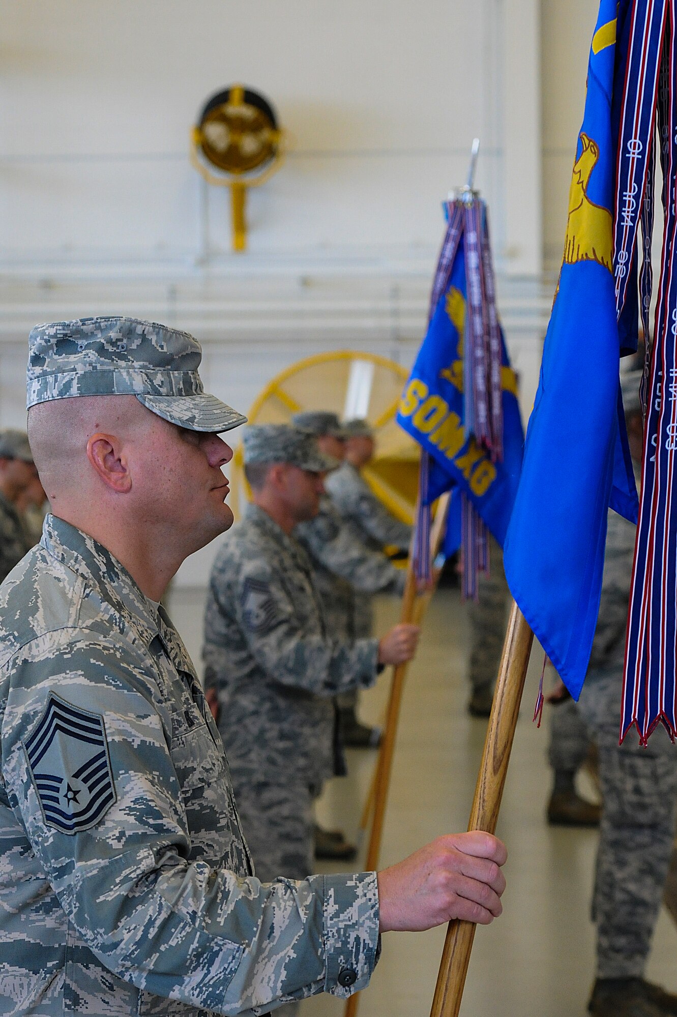 Chief Master Sgt. Daniel Leick, chief enlisted manager for 1st Special Operations Group, holds the group’s guidon during the 1st Special Opreations Wing change of command ceremony at the Freedom Hangar on Hurlburt Field, Fla., July 3, 2013. More than 500 Air Commandos attended the ceremony where Col. Jim Slife relinquished command to Col. William West. (U.S. Air Force photo/Airman 1st Class Christopher Callaway) 