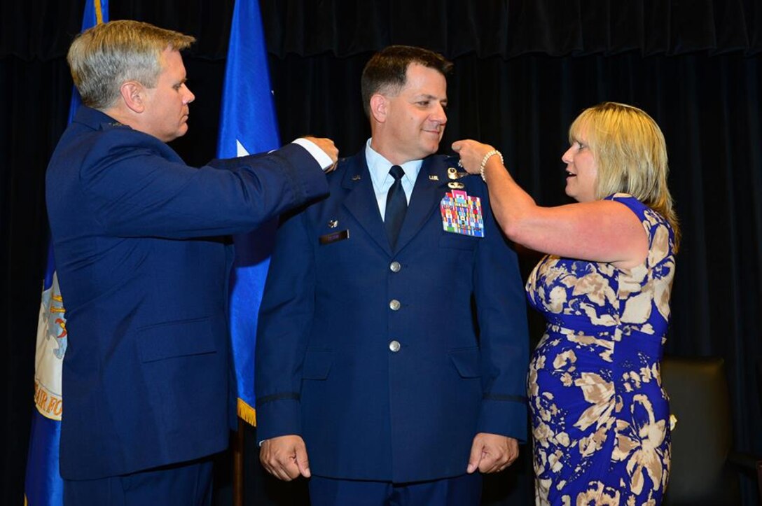 U.S. Air Force Col. Buck Elton, 27th Special Operations Wing commander, is promotoed to the rank of brigadier general by Lt. Gen. Eric Fiel, Air Force Special Operations Command commander, during a promotion ceremony in the Landing Zone at Cannon Air Force Base, N.M., July 2, 2013. Fiel spoke of Elton’s impeccable military service record and spoke of his sureness that Elton was more than capable of living up to the responsibilities that the rank of brigadier general entails. (U.S. Air Force photo/Airman 1st Class Eboni Reece)