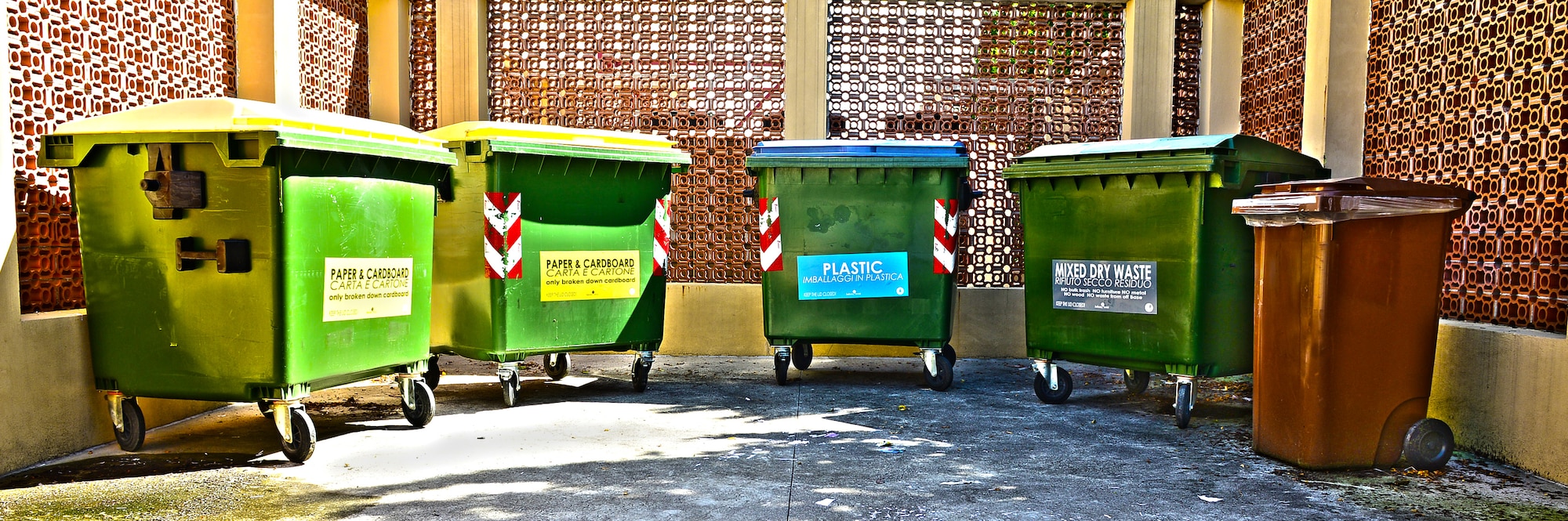 The 31st Civil Engineer Squadron has updated the sizes of the signs on the recycling bins at Aviano Air Base, Italy. While the contract for waste disposal requires the base to pay per kilogram to dispose of non-recyclable material, there is no cost to remove appropriately sorted recyclable materials such as plastic, paper/cardboard and aluminum/glass. (U.S. Air Force illustration/Airman 1st Class Matthew Lotz)