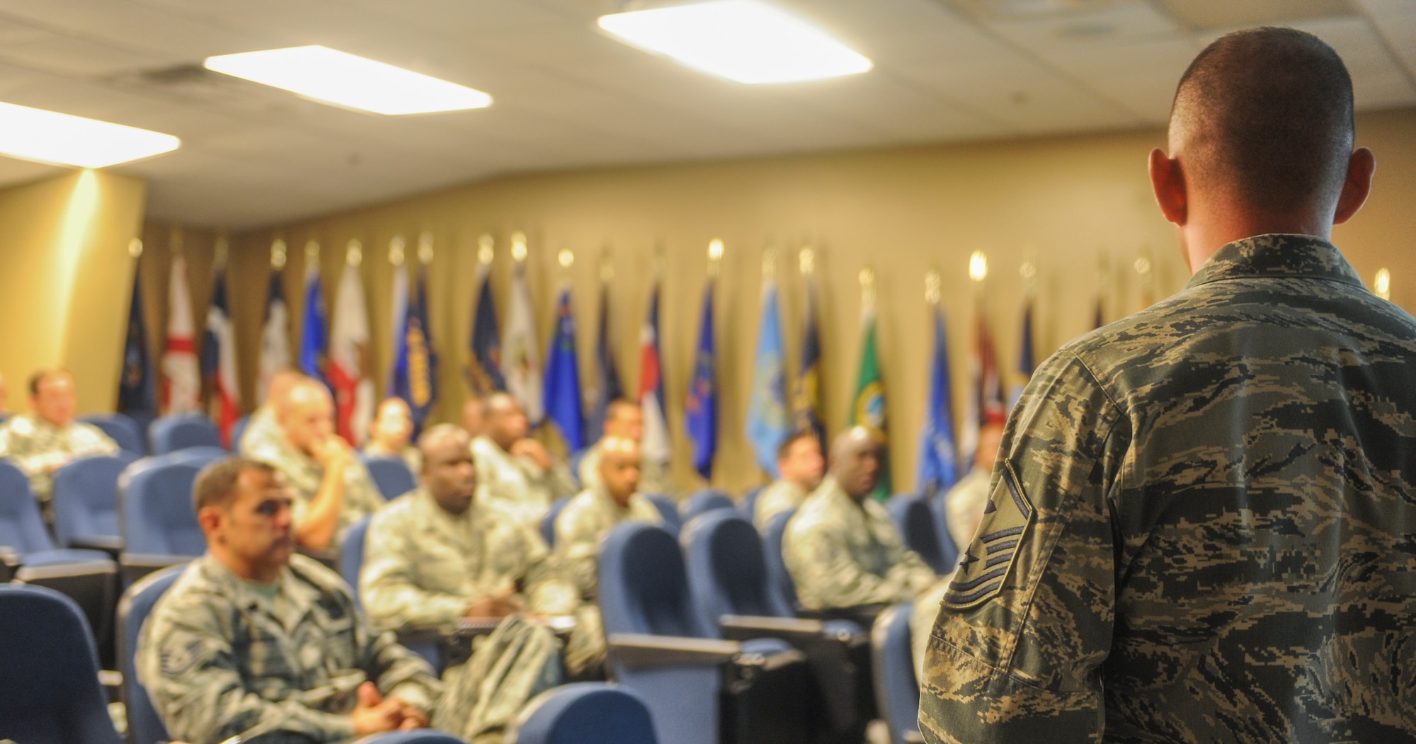 U.S. Air Force Master Sgt. Mark Diehl, 23d Comptroller Squadron and Wing Staff first sergeant, stands in front of technical and master sergeants at the First Sergeant Symposium on Moody Air Force Base, Ga., June 27, 2013. The First Sergeant Symposium is designed to recruit NCOs to become first sergeants and educate them on the daily duties of a first sergeant. (U.S. Air Force photo by Airman Alexis Grotz/Released)