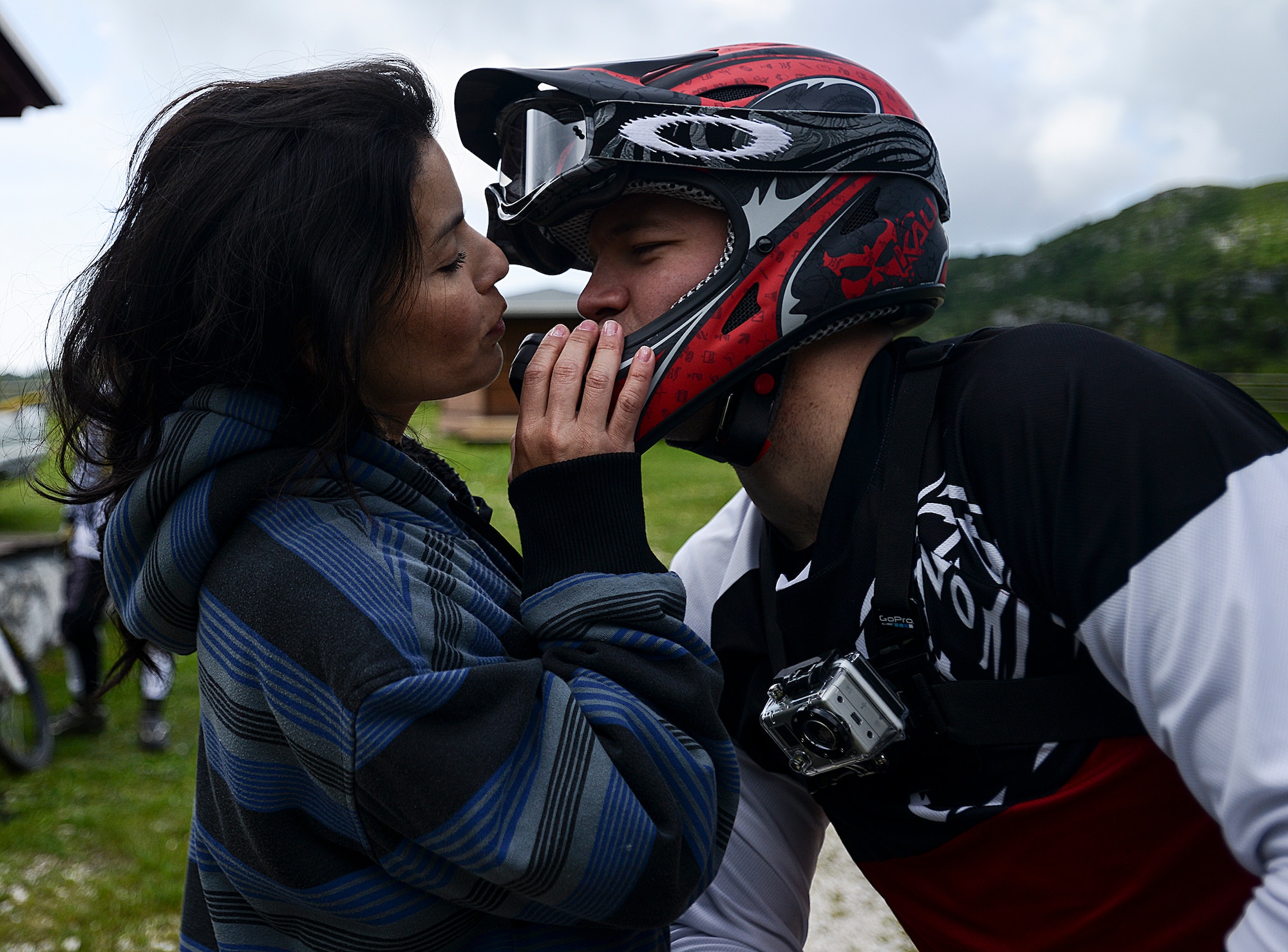 Leticia Mace kisses her husband, Staff Sgt. Alex Mace, before he rides his mountain bike down a trail in Piancavallo, Italy, June 30, 2013. Sergeant Mace suffered a near-fatal mountain biking accident on that same trail June 24, 2012. He is assigned to the 31st Fighter Wing Safety Office. (U.S. Air Force photo/Staff Sgt. Katherine Tereyama)