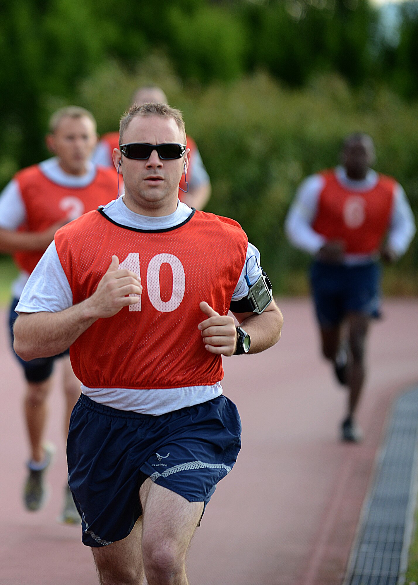 Staff Sgt. Alex Mace runs 1.5 miles during his physical fitness test June 27 at Aviano Air Base, Italy. One year ago, Mace took a jump too fast on a mountain biking trail in Piancavallo, Itally and the resulting crash snapped his sternum, lacerated the upper quarter of his heart, dissected his aorta, caused him traumatic brain and spinal cord injuries that left him paralyzed, broke both elbows, his wrist and all the ribs on his left side, which in turn pierced both of his lungs, ruptured his liver and his kidneys. This week, Mace scored a 92 percent on his physical fitness test. (U.S. Air Force photo/Staff Sgt. Ryan Whitney)