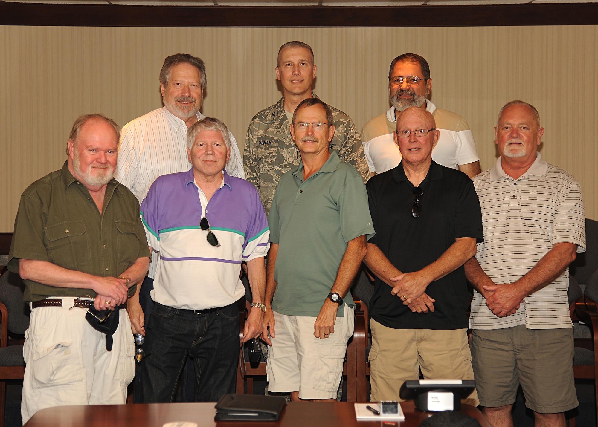 (Center) Col. Paul Bauman, 319th Air Base Wing commander, met with a group of men who had once served with t the 321st Missile Maintenance Squadron during a tour on Grand Forks Air Force Base on June 19, 2013. (U.S. Air Force Photo/Airman 1st Class Xavier Navarro)
