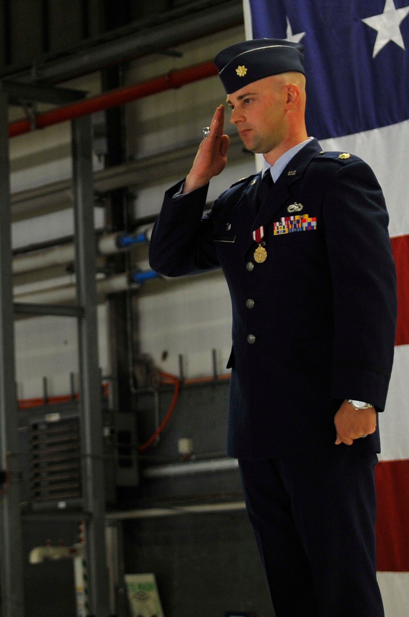 Maj. Mark Ashman, 86th Maintenance Operations Squadron commander, salutes the 86th MOS for the final time during the 86th MOS inactivation ceremony, July 1, 2013, Ramstein Air Base, Germany. The 86th MOS was inactivated and reorganized into the 86th Maintenance Group. (U.S. Air Force photo/Airman 1st Class Trevor Rhynes)