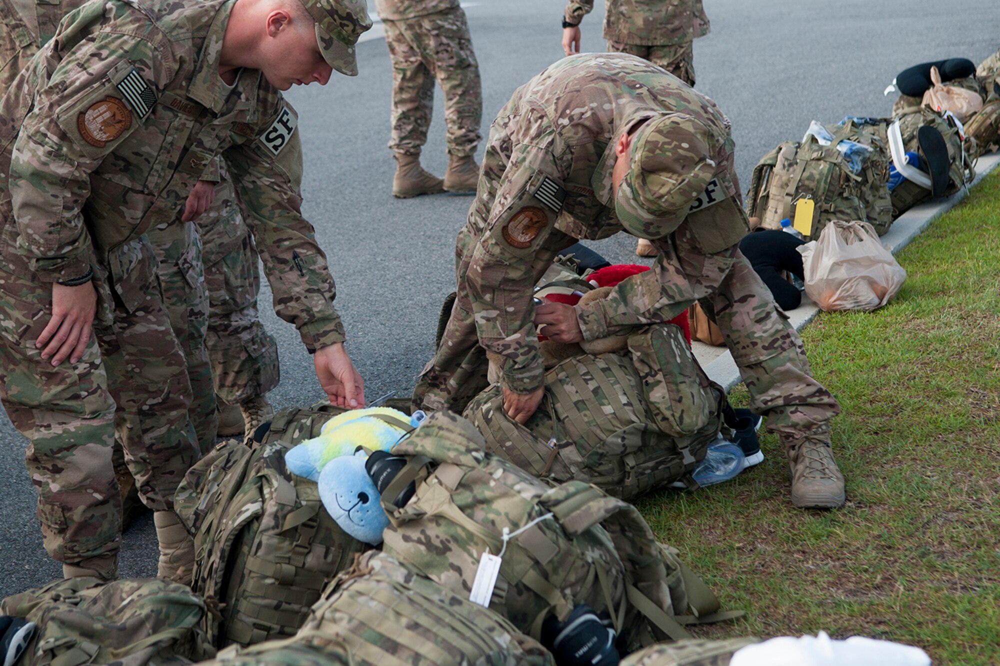 Airmen from the 823d Base Defense Squadron pack their rucksacks before deploying. The rucksacks contain essential items meant to last 72 hours. (U.S. Air Force photo by Airman 1st Class Sandra Marrero/released) 