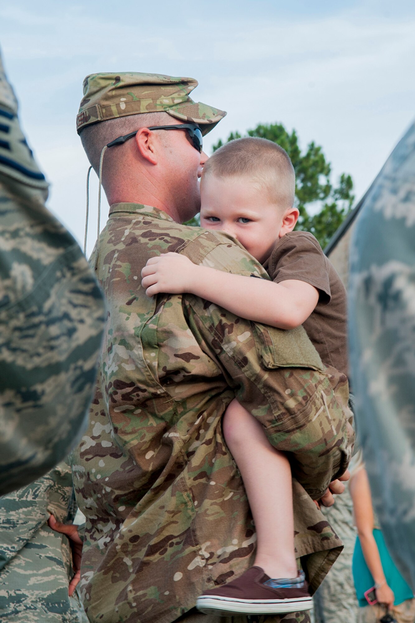 U.S Air Force Tech. Sgt. Jeremy Burkeen, 823d Base Defense Squadron K-9 kennel master, embraces his son Colton at Moody Air Force Base, Ga., June 28, 2013. Burkeen was also accompanied by his wife and other children before deploying. (U.S. Air Force photo by Airman 1st Class Sandra Marrero/released)