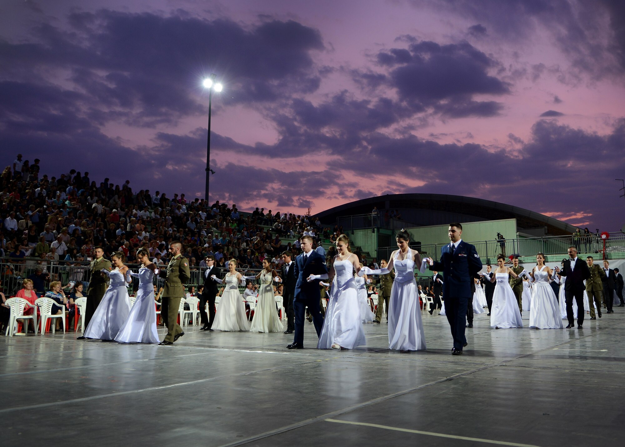 Participants present themselves during the 15th edition of Ballo delle Debuttanti June 30, 2013, in Cordenons, Italy. The ball hosted 38 debutants that were accompanied by members from the 31st Fighter Wing, the 132nd Brigata corazzata (Italian Army) and other local Italians. (U.S. Air Force photo/Staff Sgt. Evelyn Chavez)