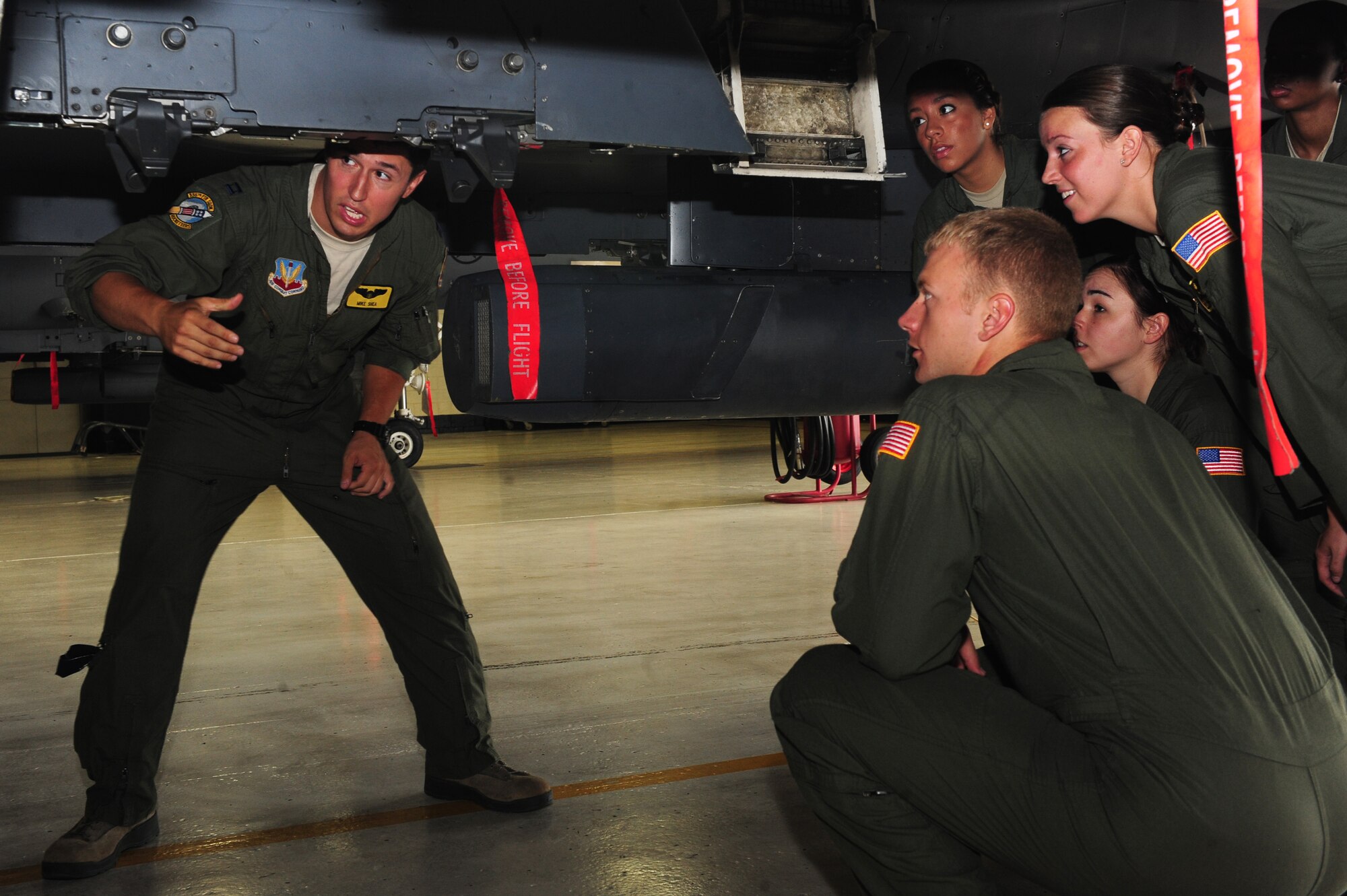 U.S. Air Force Capt. Michael Shea, 336th Fighter Squadron weapons system officer, shows U.S. Air Force Academy cadets the underbelly of an F-15E Strike Eagle at Seymour Johnson Air Force Base, N.C., June 28, 2013.  The cadets were on base to talk with individuals from different career fields to get a better idea of what they want to pursue after graduation.  (U.S. Air Force photo by Airman 1st Class Brittain Crolley/Released)