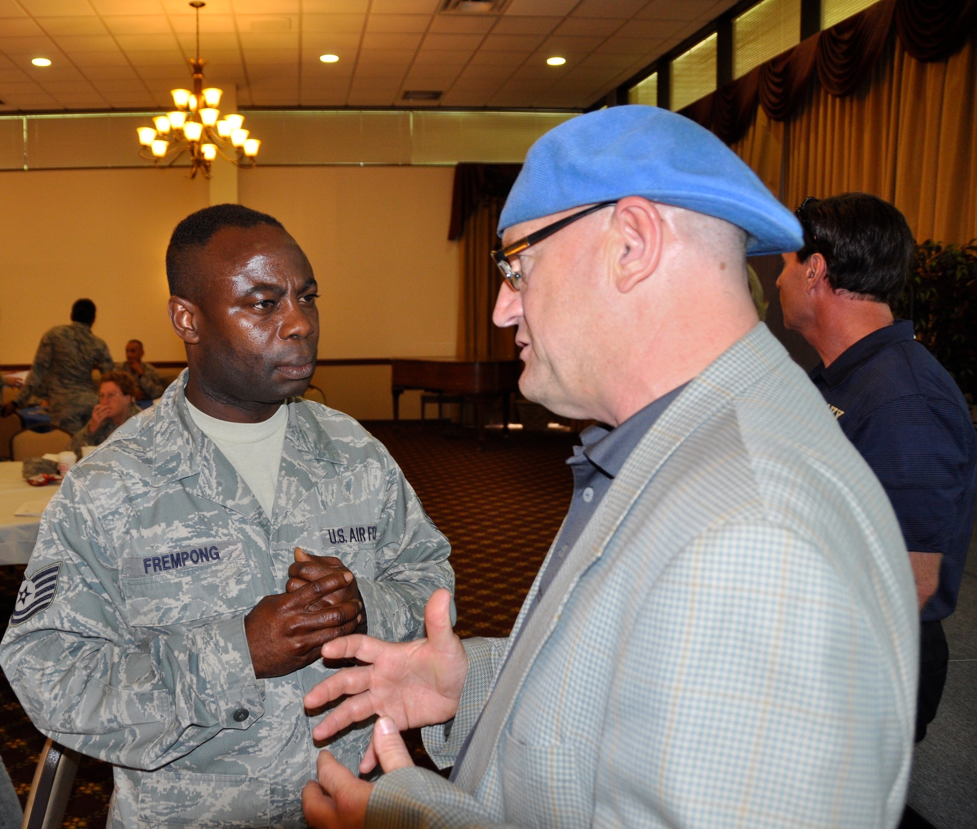 Joe Krause, Philadelphia Soul Football Vice President of Ticket Sales, engages in a conversation with Tech. Sgt. Kwabena Frempong, 35th Aerial Port Squadron, immediately following a professional athlete and coach panel during the 514th Air Mobility Wing Human Resource Development Council (HRDC) mentoring workshop held here, Jun. 22-23. (U.S. Air Force photo by Senior Airman Chelsea Smith) 
