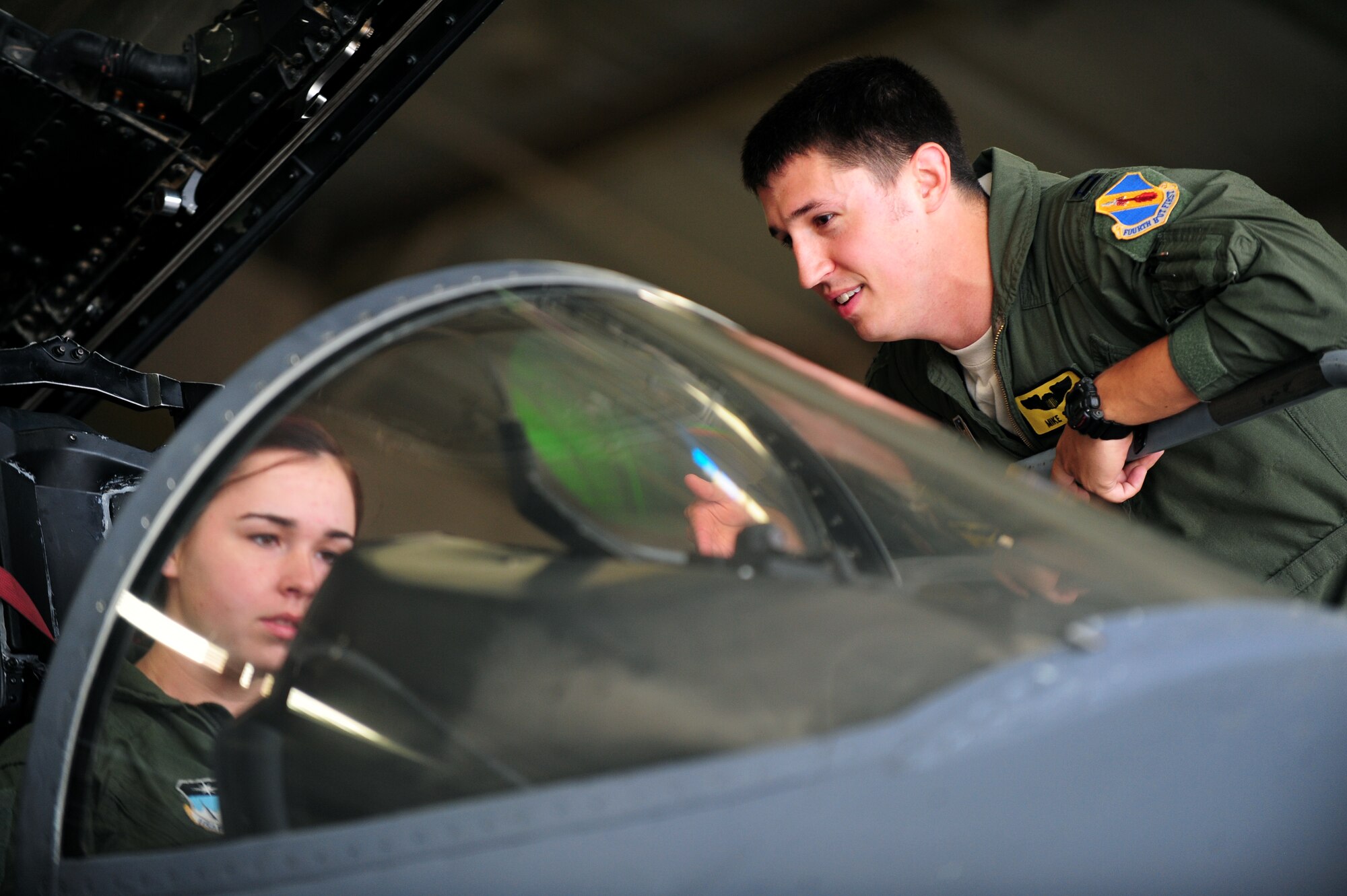U.S. Air Force Capt. Michael Shea, 336th Fighter Squadron weapons system officer (WSO), shows U.S. Air Force Academy Cadet Victoria Rathbone the cockpit of an F-15E Strike Eagle at Seymour Johnson Air Force Base, N.C., June 28, 2013.  Shea escorted a group of cadets around the squadron and flightline to give them an inside look into the life of a pilot and WSO.  (U.S. Air Force photo by Airman 1st Class Brittain Crolley/Released)