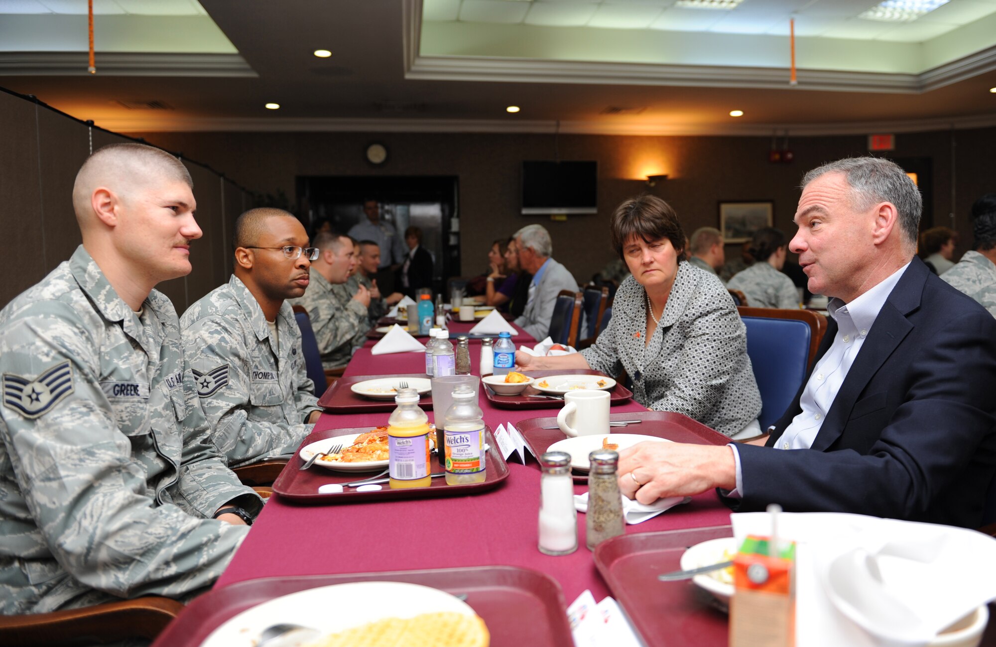 Staff Sgt. Daniel Greene, 39th Logistics Readiness Squadron fuels manager, listens to Tim Kaine, U.S. senator from Virginia, during a conversation about sequestration on July 2, 2013, at Incirlik Air Base, Turkey. Airmen had the opportunity to have breakfast with senators from their states during a congressional delegation visit July 1-2. (U.S. Air Force photo by Senior Airman Chase Hedrick/Released)