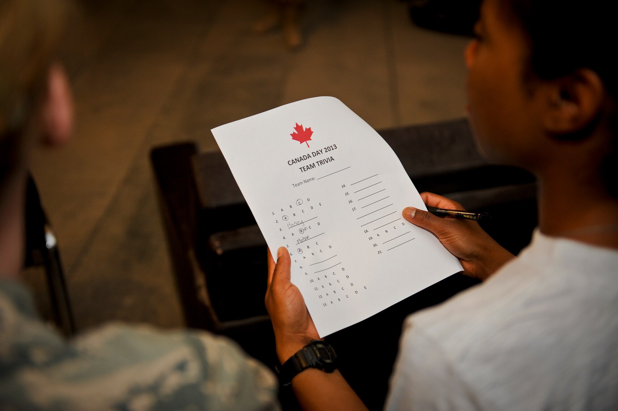 U.S. Air Force 1st Lt. Brianna Spivey takes part in a Canada Day Team Trivia competition during the Canada Day celebration at the 379th Air Expeditionary Wing in Southwest Asia, July 1, 2013. Spivey is a U.S. Air Force 71st Expeditionary Air Control Squadron air battle manager deployed from Eglin Air Force Base, Fla. (U.S. Air Force photo/Senior Airman Benjamin Stratton)