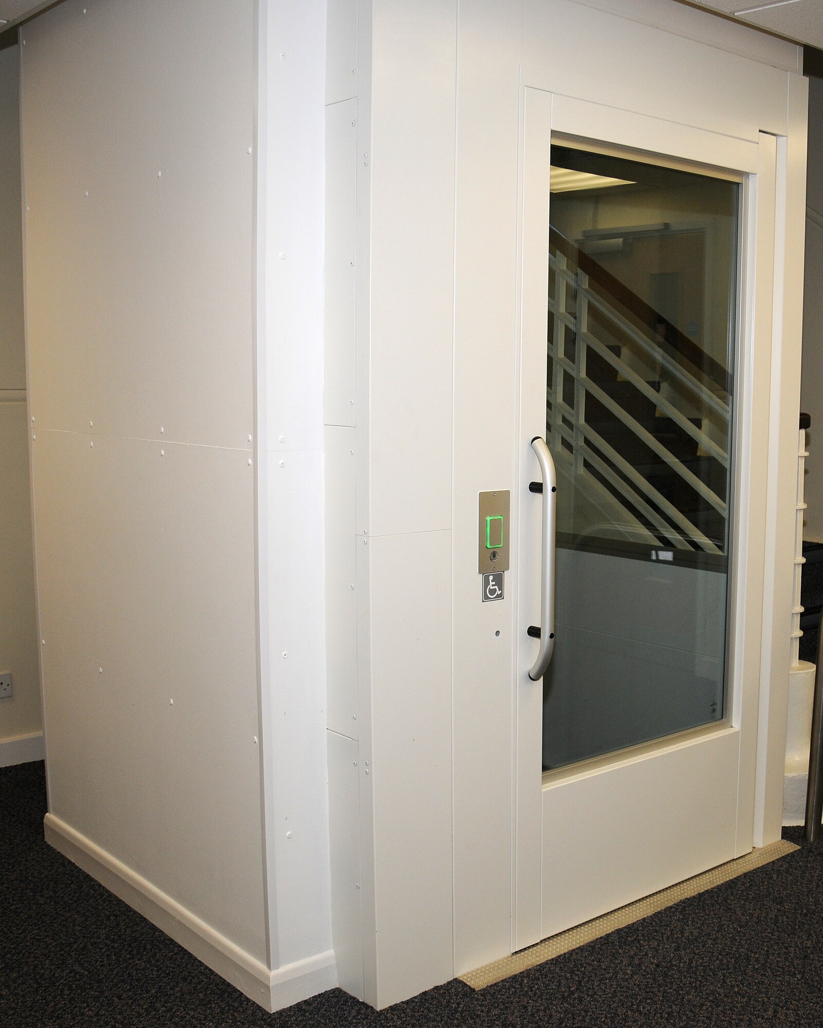 A newly-fitted elevator allows for easier access to the offices and classrooms on the second floor in the Airman and Family Readiness Center June 27, 2013, on RAF Mildenhall, England. Customers such as wounded warriors, casualty assistance or those recovering from surgery are now able to access all areas in the center. Throughout the building there are slopes into rooms and automatic doors to enable better access. (U.S. Air Force photo by Gina Randall/Released)