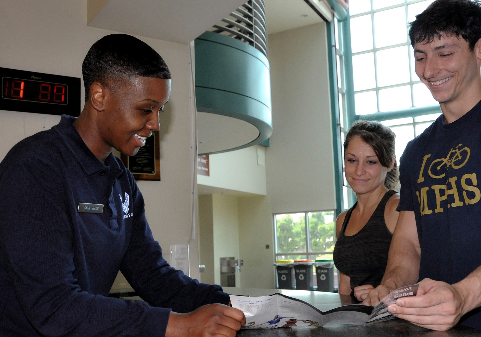 Capt. Ilechukwu Agu, 731st Air Mobility Squadron air freight officer in charge, adds free weights to a bar at the fitness center on Osan Air Base, Republic of Korea, June 28, 2013. Equipment orientation is one of the services offered by fitness staff, helping members learn how to properly use items in the gym. (U.S. Air Force photo/Senior Airman Kristina Overton)