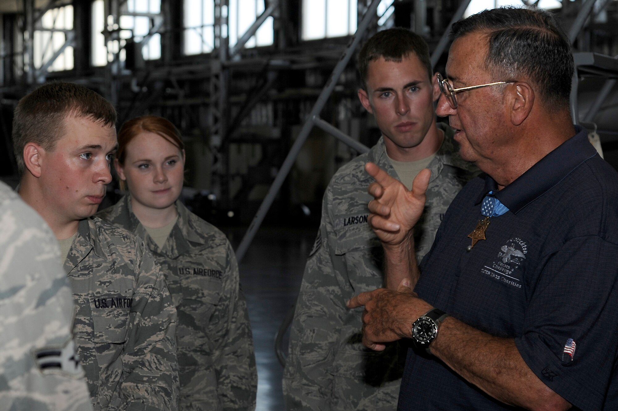 U.S. Marine Corp Col. (ret.) Jay Vargas, Medal of Honor recipient, talks to Airmen from the 35th Aircraft Maintenance Squadron about stories from his time in the military during a recent visit to Misawa Air Base, Japan, July 2, 2013. Vargas joined Gary Sinise and the Lt. Dan Band during their United Service Organizations tour. (U.S. Air Force photo by Tech. Sgt. Marie Brown)
