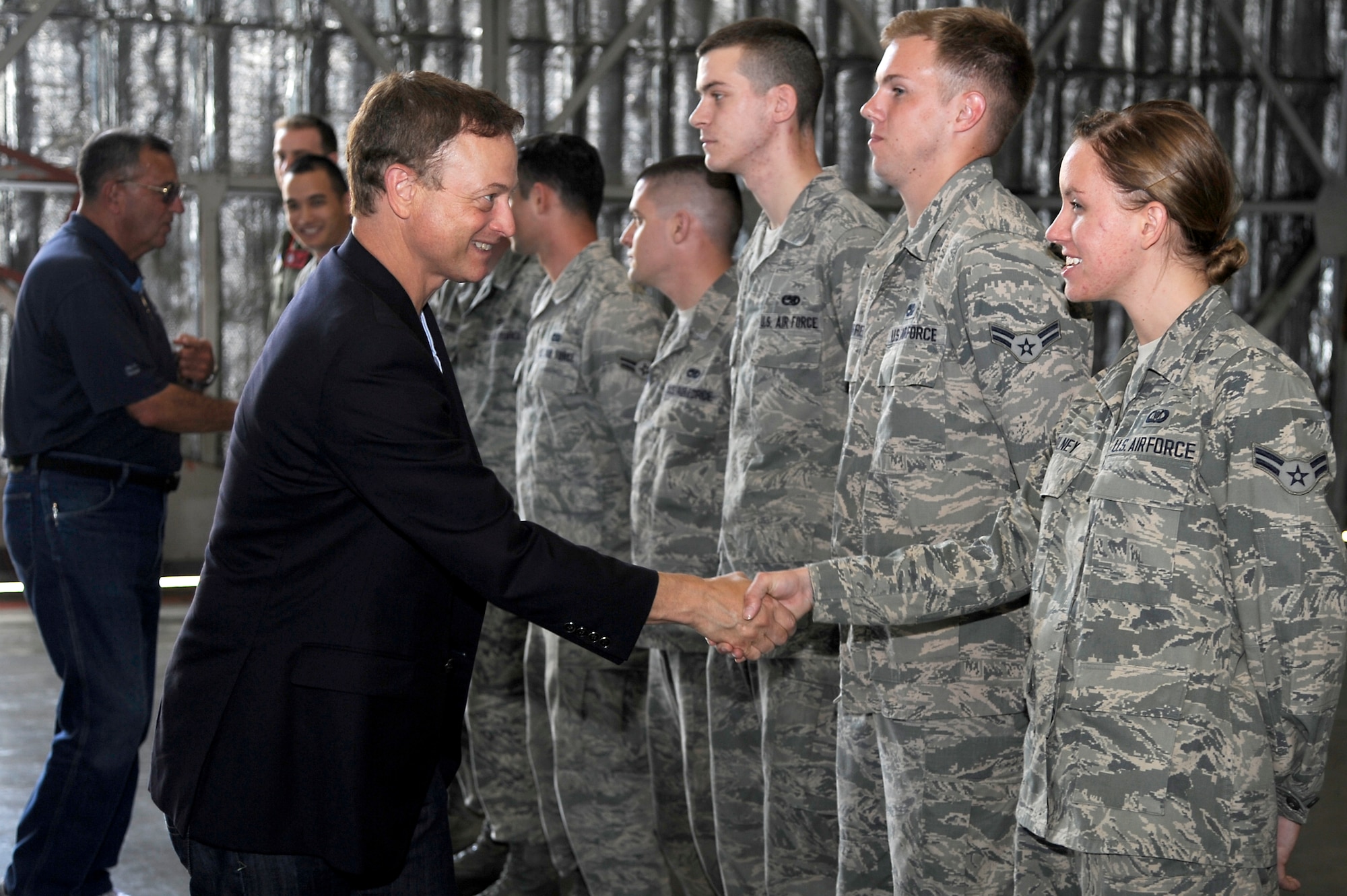 Gary Sinise shakes hands with Airmen of the 35th Aircraft Maintenance Squadron during a recent visit to Misawa Air Base, Japan, July 2, 2013. The visit was part of a United Service Organizations tour, which was orchestrated to support morale for service members and their families. (U.S. Air Force photo by Tech. Sgt. Marie Brown)
