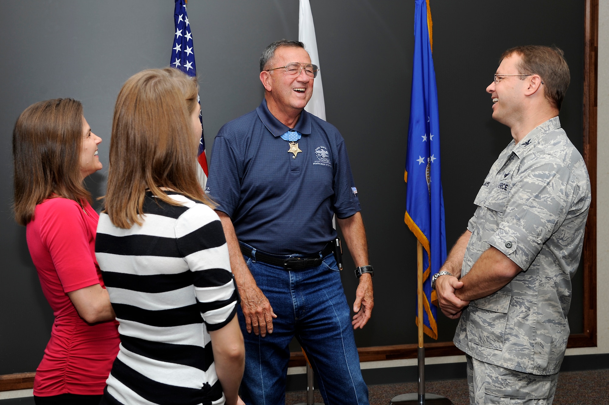 U.S. Air Force Col. Stephen Williams, right, 35th Fighter Wing commander and his wife Holly, left, and daughter Ashley talks with Medal of Honor recipient US. Marine Corp Col. (ret.) Jay Vargas during a recent visit to Misawa Air Base, Japan, July 2, 2013. Vargas joined Gary Sinise and the Lt. Dan Band during their United Service Organizations tour. During their visit Gary Sinise and Vargas took time out to visit with Airmen around the base. (U.S. Air Force photo by Tech. Sgt. Marie Brown)

