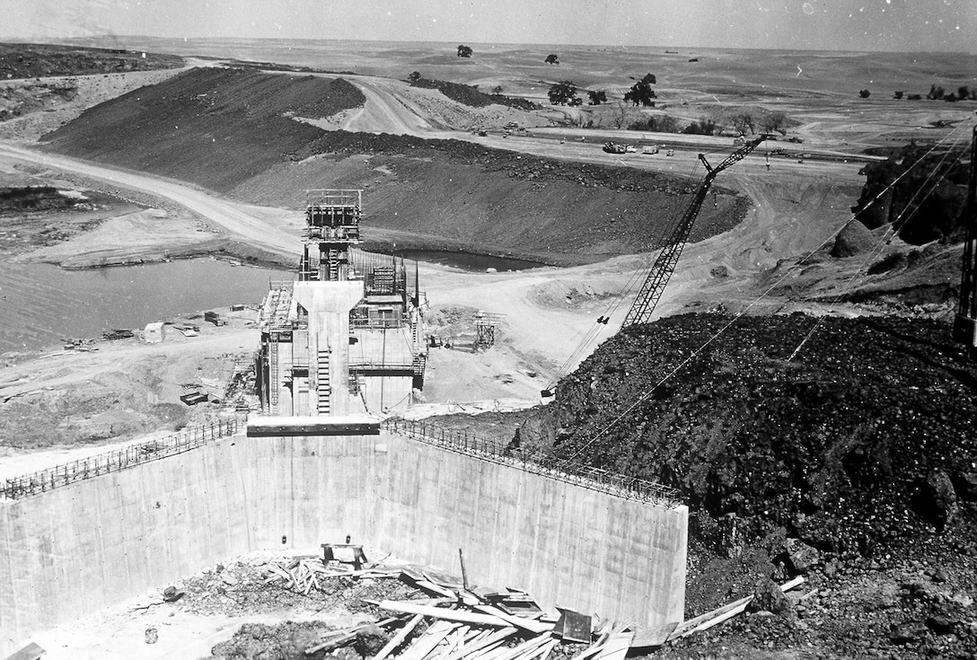 Black Butte Dam continues to rise from the hills near Orland as the control structure takes shape in the early '60s.