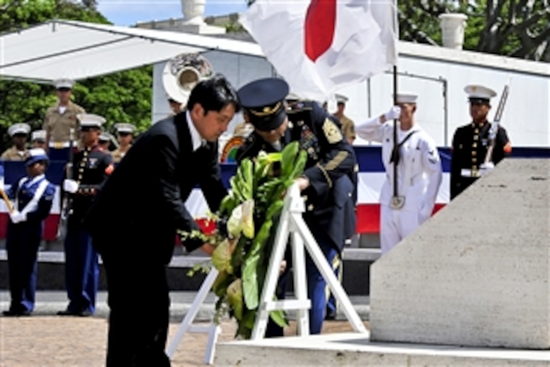 Japanese Defense Minister Itsunori Onodera honors American veterans during a wreath-laying ceremony at the National Memorial Cemetery of the Pacific in Honolulu, July 1, 2013. Onodera paid respects to American service members who lost their lives and the late U.S. Sen. Daniel K. Inouye of Hawaii. 