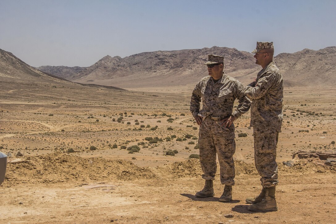 Lt. Gen. Robert Neller, Marine Force Central Command (MARCENT) commanding general, and Brig. Gen. Gregg Olson, MARCENT (Forward) commanding general, watch the Marines of the 26th Marine Expeditionary Unit (MEU) during the final exercise rehearsal as part of their visit to Al Quweira, Jordan, during Exercise Eager Lion 2013, June 16, 2013. Exercise Eager Lion 2013 is an annual, multinational exercise designed to strengthen military-to-military relationships and enhance security and stability in the region by responding to modern-day security scenarios.  The 26th MEU is deployed to the 5th Fleet area of responsibility as part of the Kearsarge Amphibious Ready Group. The 26th MEU operates continuously across the globe, providing the president and unified combatant commanders with a forward-deployed, sea-based quick reaction force. (U.S. Marine Corps photo by Cpl. Michael S. Lockett, 26th MEU Public Affairs)