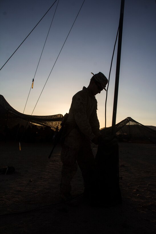 Cpl. Conor McGrath, company radio operator from Branchville, N.J., assigned to Company K, Battalion Landing Team 3/2, 26th Marine Expeditionary Unit, adjusts an OE-254 radio antennae during Exercise Eager Lion 2013 in Al Quweira, Jordan, June 18, 2013. Exercise Eager Lion 2013 is an annual, multinational exercise designed to strengthen military-to-military relationships and enhance security and stability in the region by responding to modern-day security scenarios.  The 26th MEU is deployed to the 5th Fleet area of responsibility as part of the Kearsarge Amphibious Ready Group. The 26th MEU operates continuously across the globe, providing the president and unified combatant commanders with a forward-deployed, sea-based quick reaction force. (U.S. Marine Corps photo by Cpl. Michael S. Lockett, 26th MEU Public Affairs)