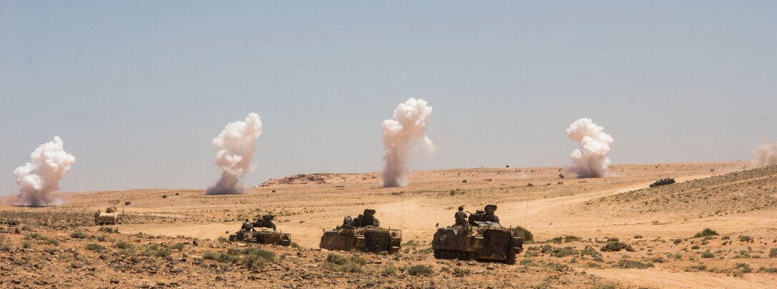 U.S. Marines the 26th Marine Expeditionary Unit (MEU) take part in a mechanized assault during the Combined Arms Live Fire Exercise, the culminating event of Exercise Eager Lion 2013 in Al Quweira, Jordan, June 19, 2013. Exercise Eager Lion 2013 is an annual, multinational exercise designed to strengthen military-to-military relationships and enhance security and stability in the region by responding to modern-day security scenarios.  The 26th MEU is deployed to the 5th Fleet area of responsibility as part of the Kearsarge Amphibious Ready Group. The 26th MEU operates continuously across the globe, providing the president and unified combatant commanders with a forward-deployed, sea-based quick reaction force. (U.S. Marine Corps photo by Cpl. Michael S. Lockett, 26th MEU Public Affairs)