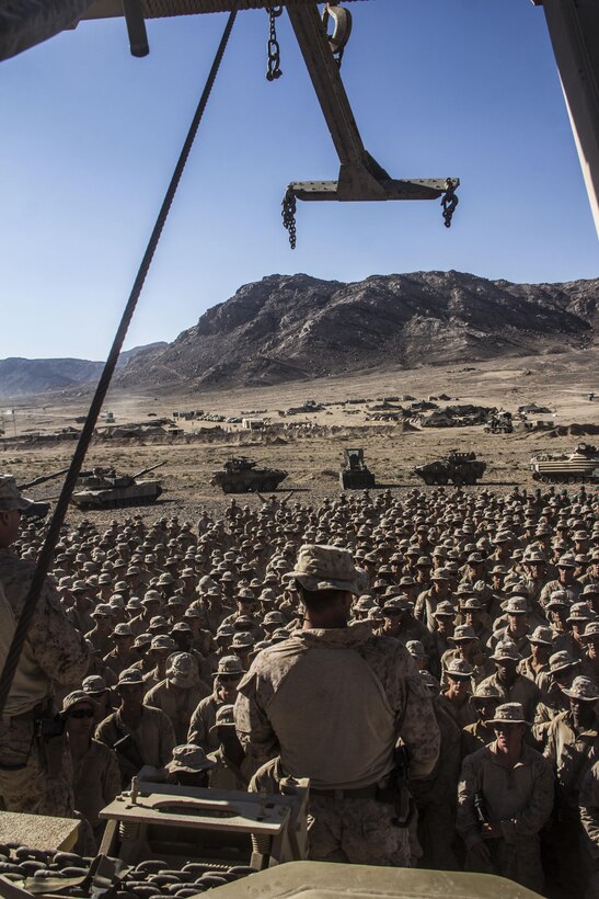 Lt. Col. Charles Cassidy, battalion commander of Battalion Landing Team 3/2, 26th Marine Expeditionary Unit (MEU), congratulates his Marines after their participation in the Combined Arms Live Fire Exercise, the culminating event of Exercise Eager Lion 2013 in Al Quweira, Jordan, June 19, 2013. Exercise Eager Lion 2013 is an annual, multinational exercise designed to strengthen military-to-military relationships and enhance security and stability in the region by responding to modern-day security scenarios.  The 26th MEU is deployed to the 5th Fleet area of responsibility as part of the Kearsarge Amphibious Ready Group. The 26th MEU operates continuously across the globe, providing the president and unified combatant commanders with a forward-deployed, sea-based quick reaction force. (U.S. Marine Corps photo by Cpl. Michael S. Lockett, 26th MEU Public Affairs)