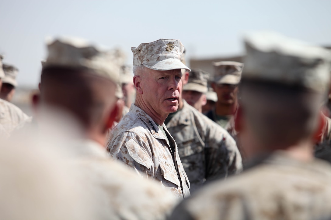 Commandant of the Marine Corps, Gen. James F. Amos, speaks to Marines and sailors with Regimental Combat Team 7, at the II Marine Expeditionary Force Forward compound aboard Camp Leatherneck, Afghanistan, June 18. Amos traveled with Sgt. Maj. of the Marine Corps Michael P. Barrett to visit RCT-7, Combat Logistics Regiment 2 and 2d Marine Aircraft Wing Forward, not only to talk to Marines and sailors about the state of the Corps, but also to answer any questions they had about sequestration, promotions, Afghanistan and the future of the Marine Corps.
