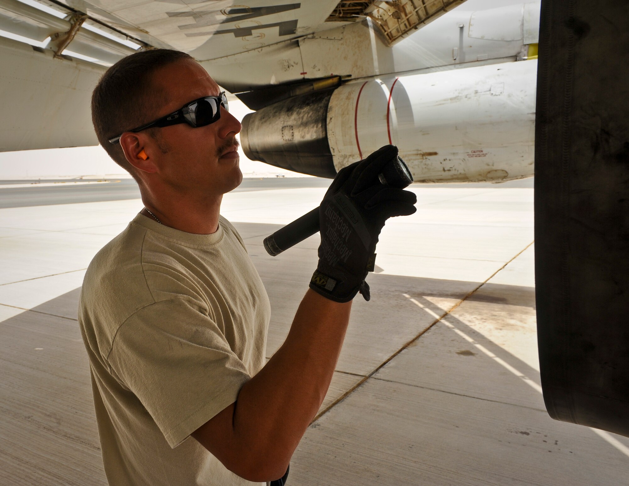 Staff Sgt. Lee Watkins inspects an E-8C Joint Surveillance Target Attack Radar System engine after returning from a mission at the 379th Air Expeditionary Wing in Southwest Asia, June 28, 2013. Joint STARS is capable of determining the direction, speed and patterns of military activity of ground vehicles and helicopters. Watkins is a 7th Expeditionary Aircraft Maintenance Unit crew chief deployed from Robins Air Force Base, Ga. (U.S. Air Force photo/Senior Airman Benjamin Stratton)