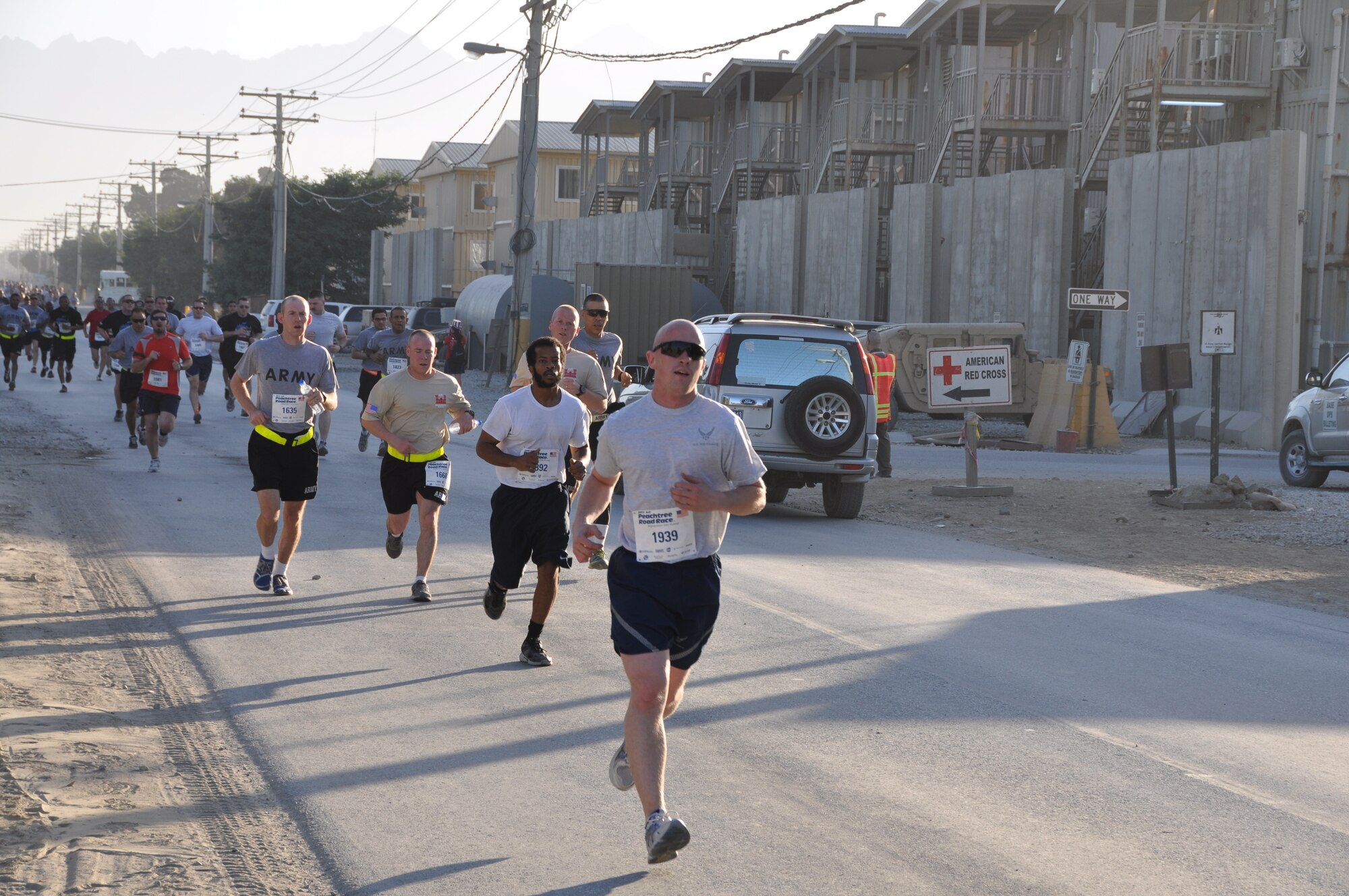 Several runners maintain a good pace during an overseas shadow for the Peachtree 10-kilometer run on Bagram Airfield, Afghanistan, July 4. The morale, welfare and recreation office coordinated with the Atlanta Track Club to hold the road race, which drew more than 600 runners. (U.S. Air Force photo/Tech. Sgt. Rob Hazelett)